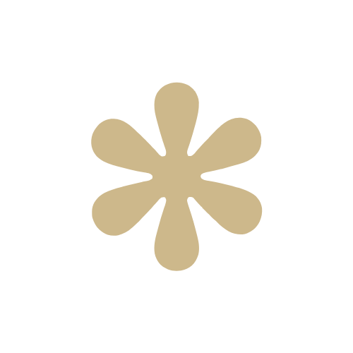 A beige flower-shaped object with six rounded petals against a black background.