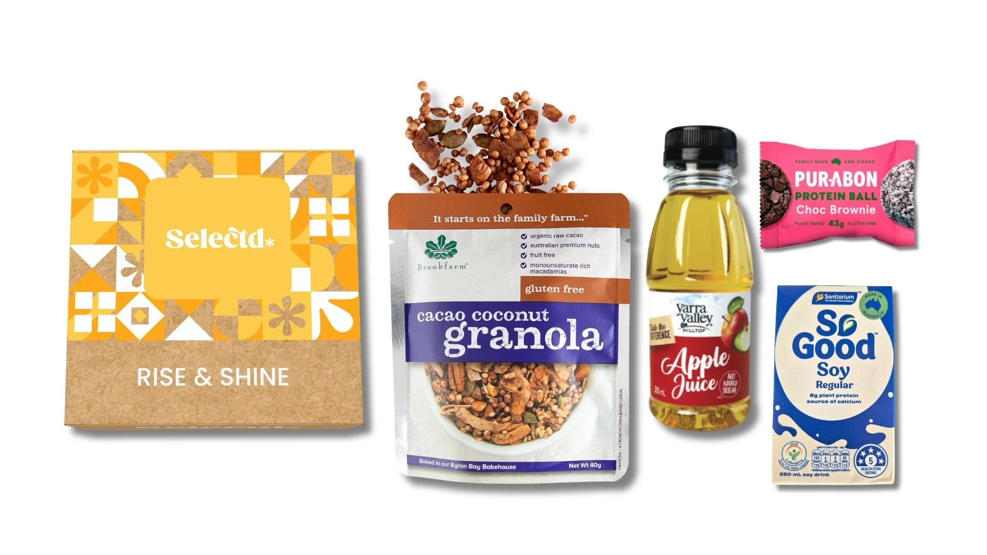 Eco-friendly, recycled and sustainable box Selectd Rise & Shine, Brookfarm Gluten Free coconut granola, bottle of apple juice, protein ball, and a blue carton of dairy free dietary soy milk.