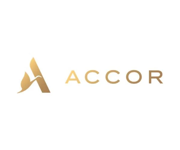 The image displays the logo of ACCOR, featuring a stylized gold and brown letter A and the word 'ACCOR' in gold and brown lettering.