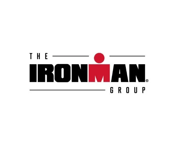 Logo for The Ironman Group with black and red text on a white background.