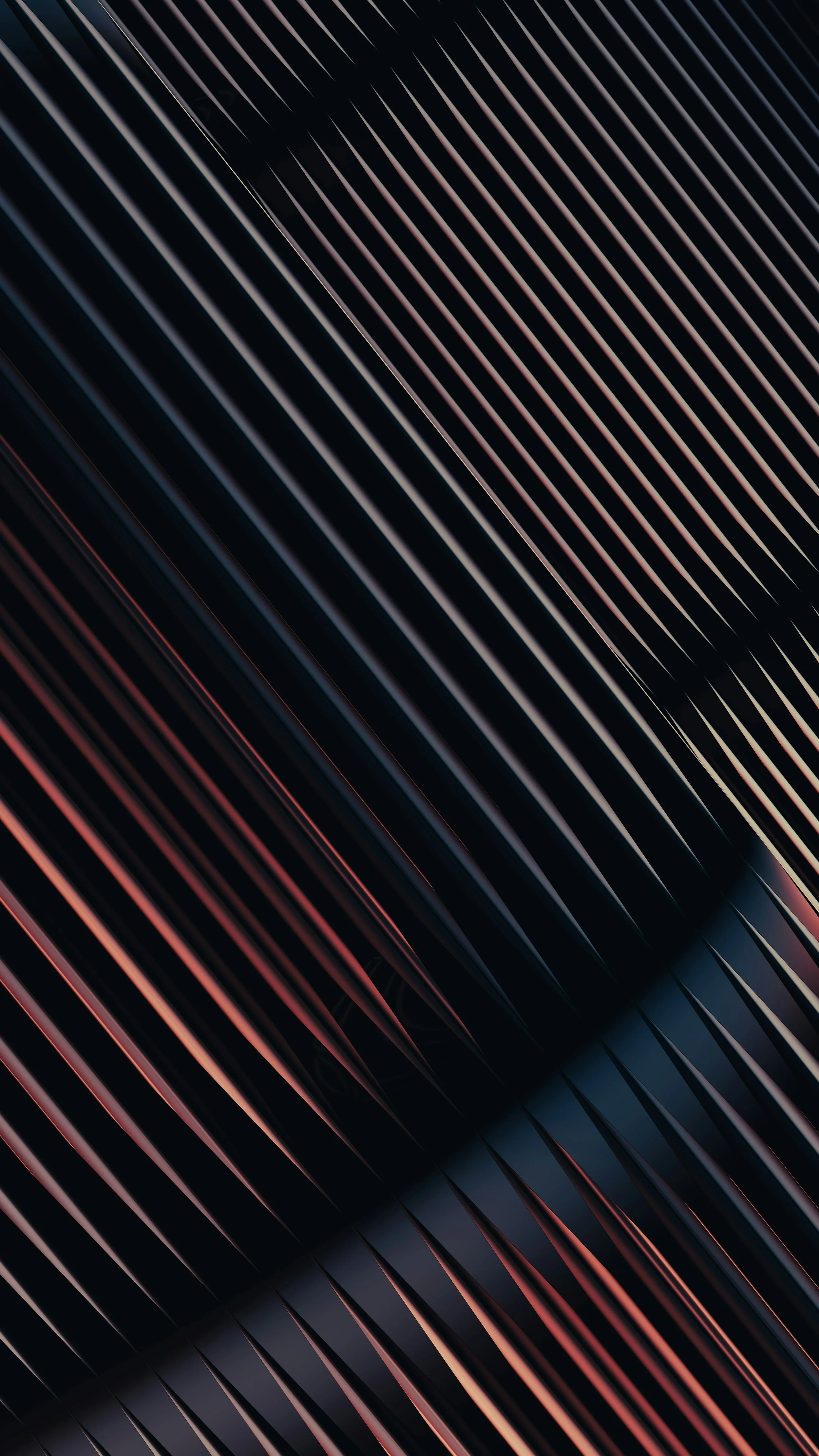 Close-up of a sleek, black, metallic surface with parallel ridges and subtle red and blue reflections.
