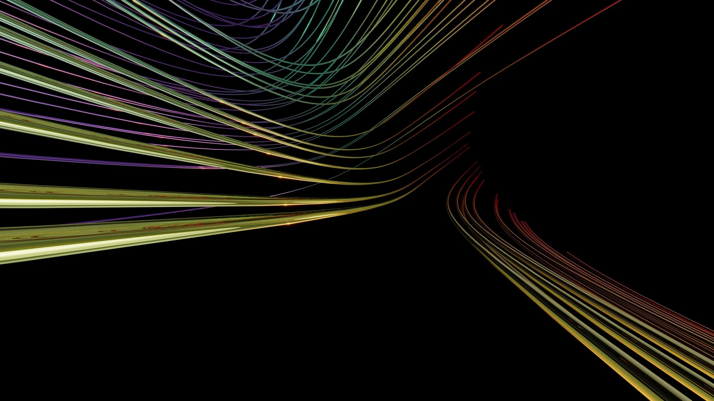 Colorful light trails flowing against a black background, creating a dynamic, abstract pattern.
