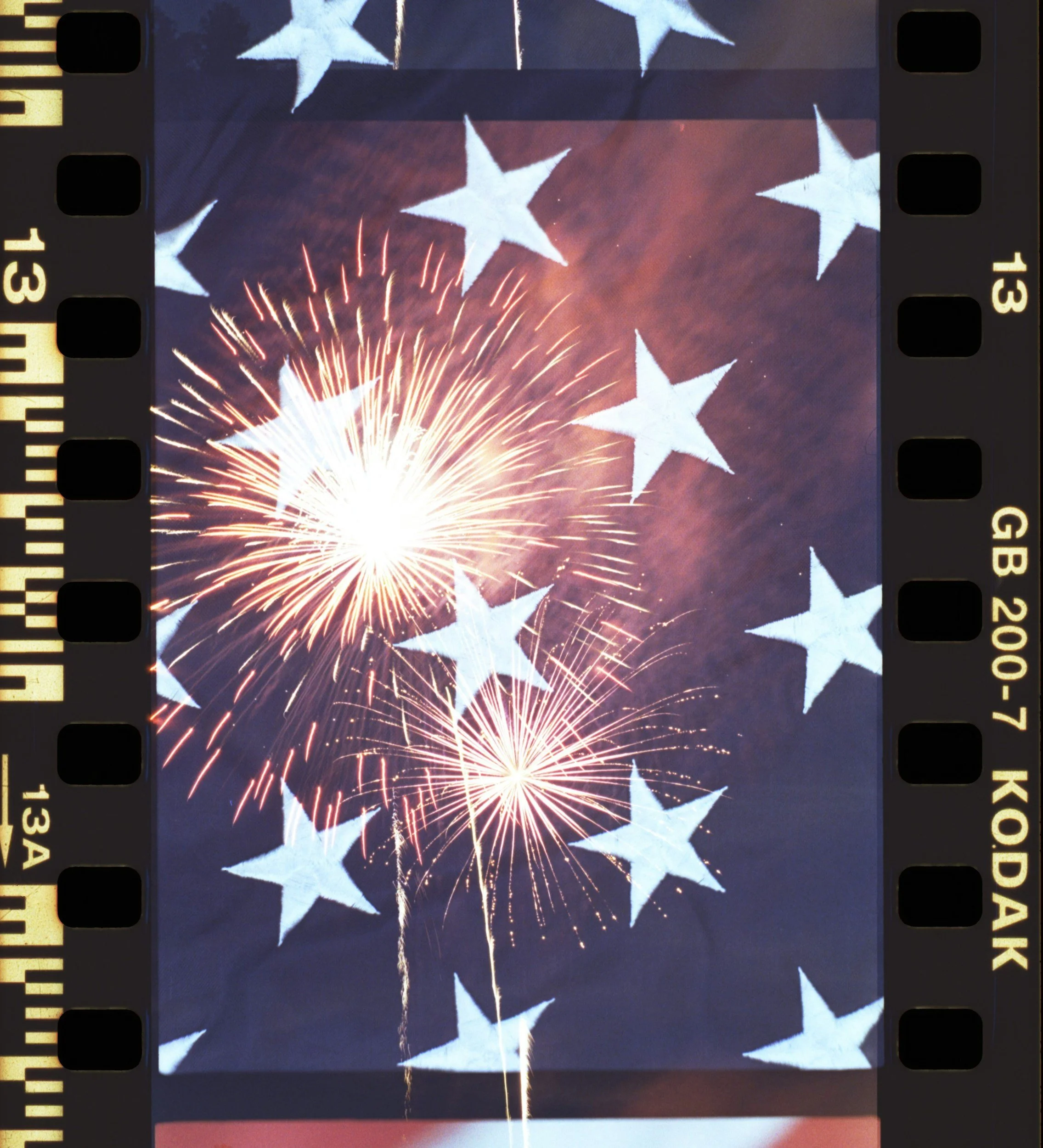 Fireworks display against a dark sky overlaid with white stars.