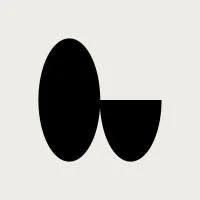 Abstract black shapes on a light background, resembling a stylized face or object.