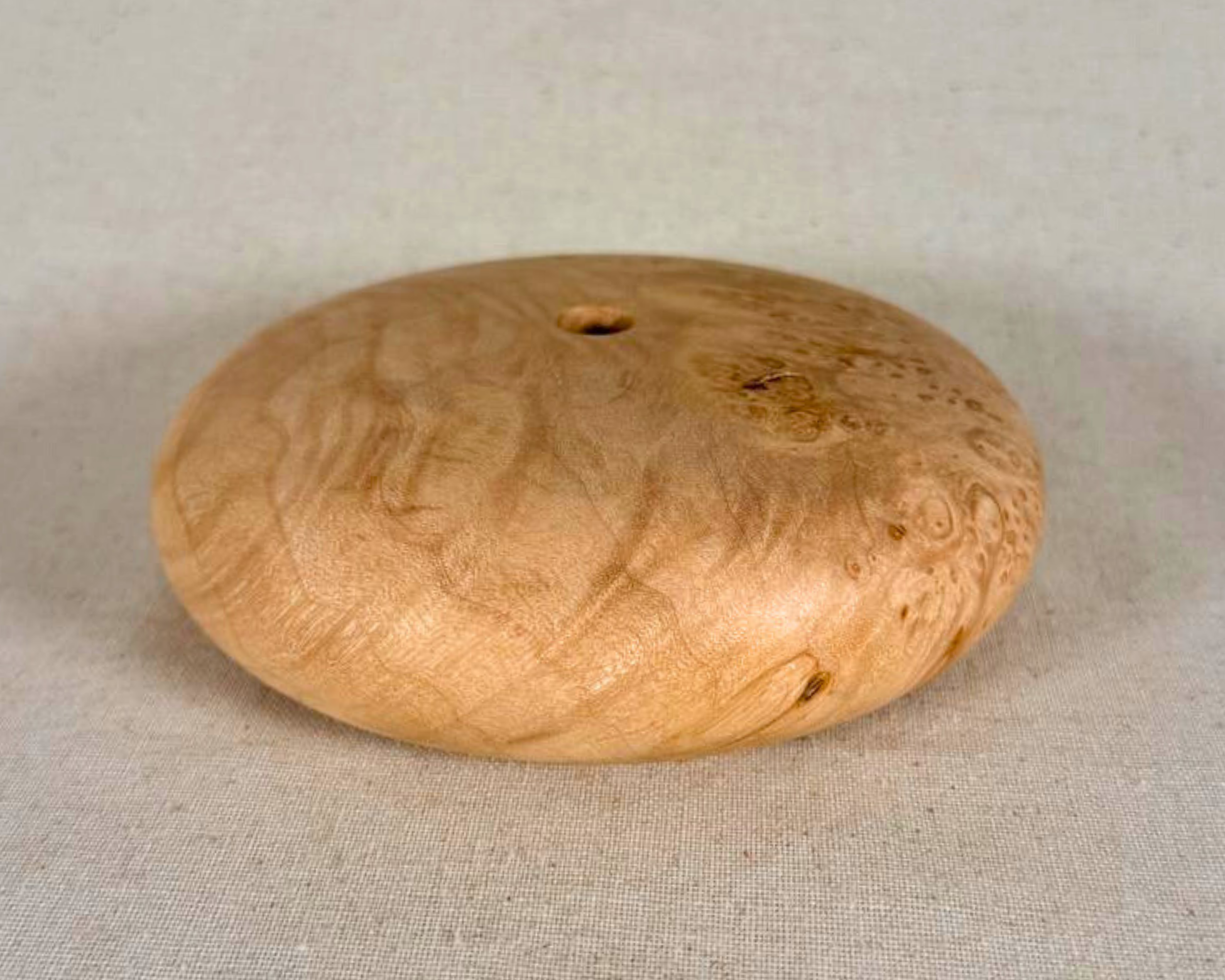 Overhead view of the maple burl form with the small opening and asymmetrical distribution of burl figure across the surface.