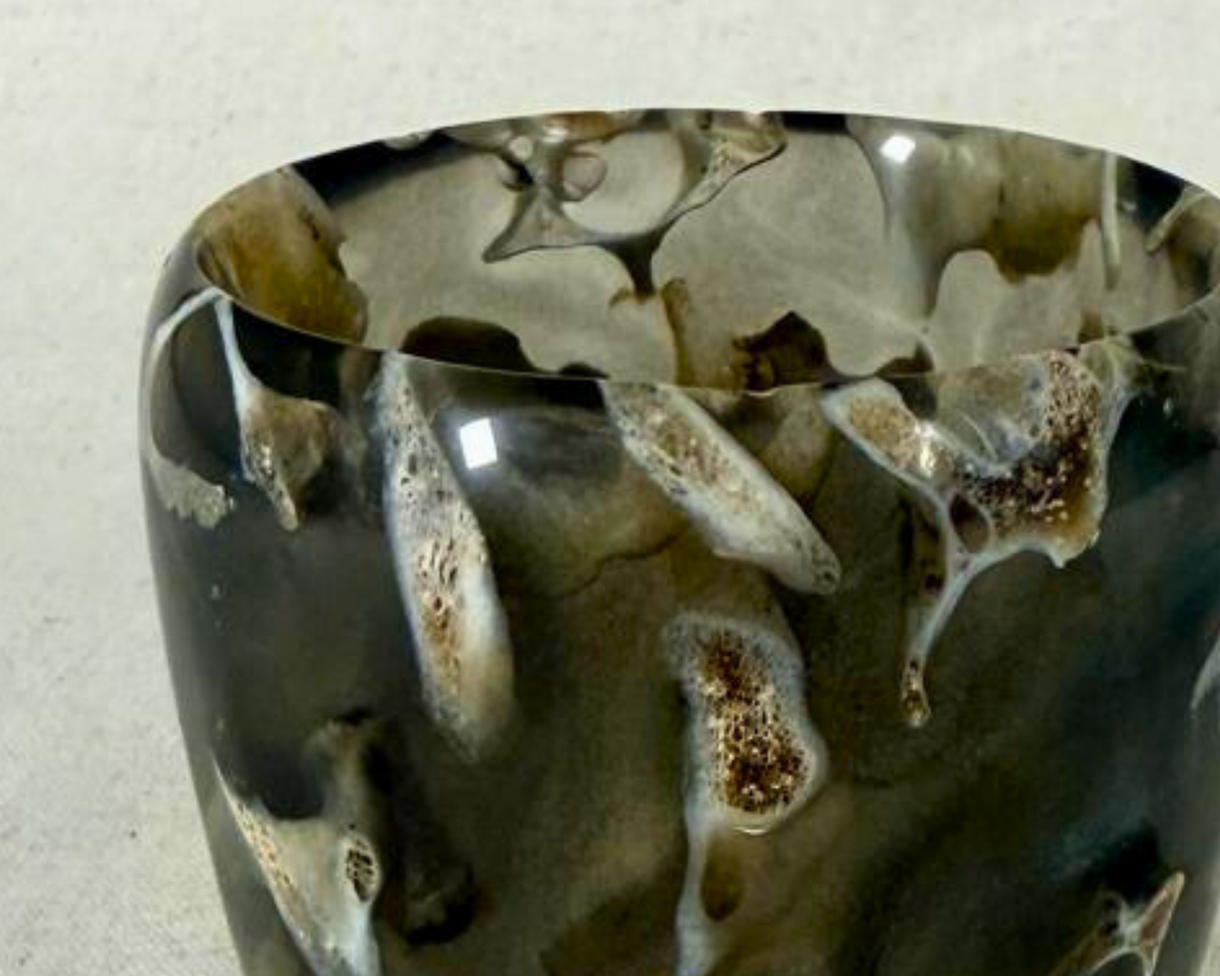 Woodturned art vessel with vertebrae suspended in smoky epoxy, Treverk Woodturning by Mark Taylor, close up rim view.