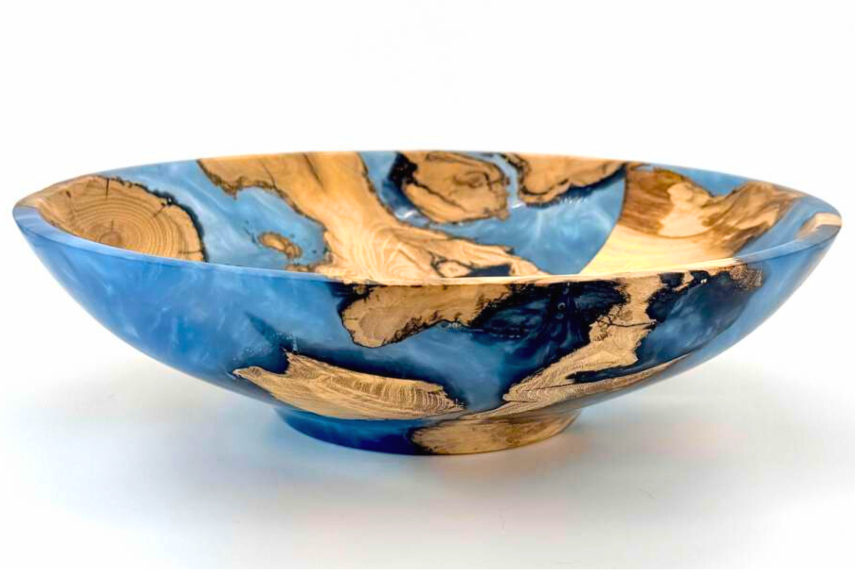 Decorative bowl made of wood and resin with blue and natural wood grain pattern.