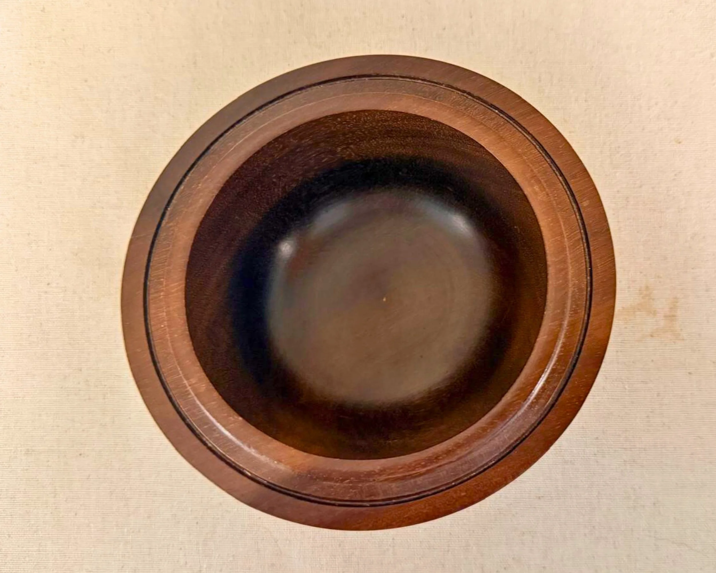 Overhead view of rosewood bowl showing concentric turning marks and dark rosewood tone.