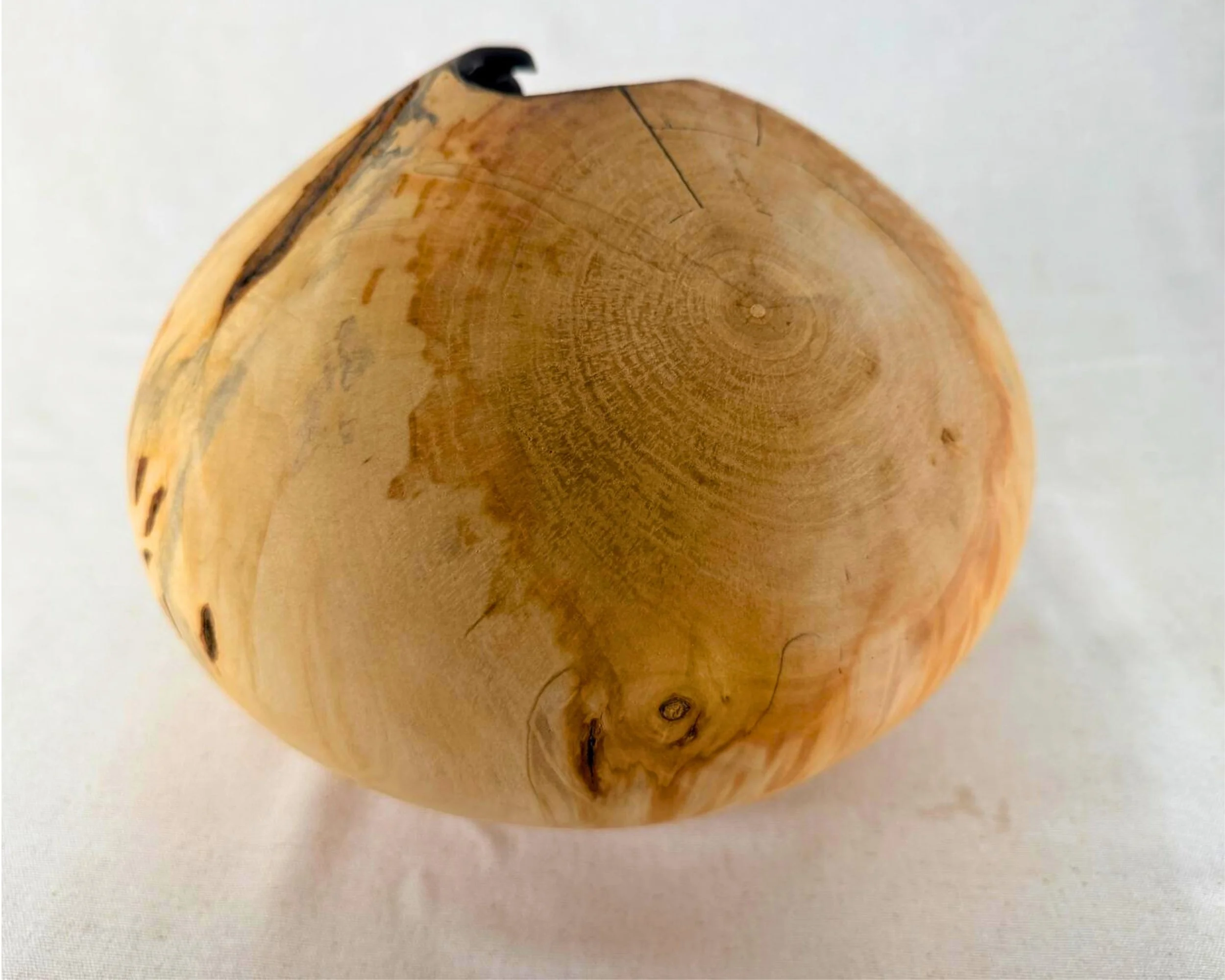 Back view of the reclaimed pine piece featuring visible growth rings, fine checking lines, and warm tone variation.