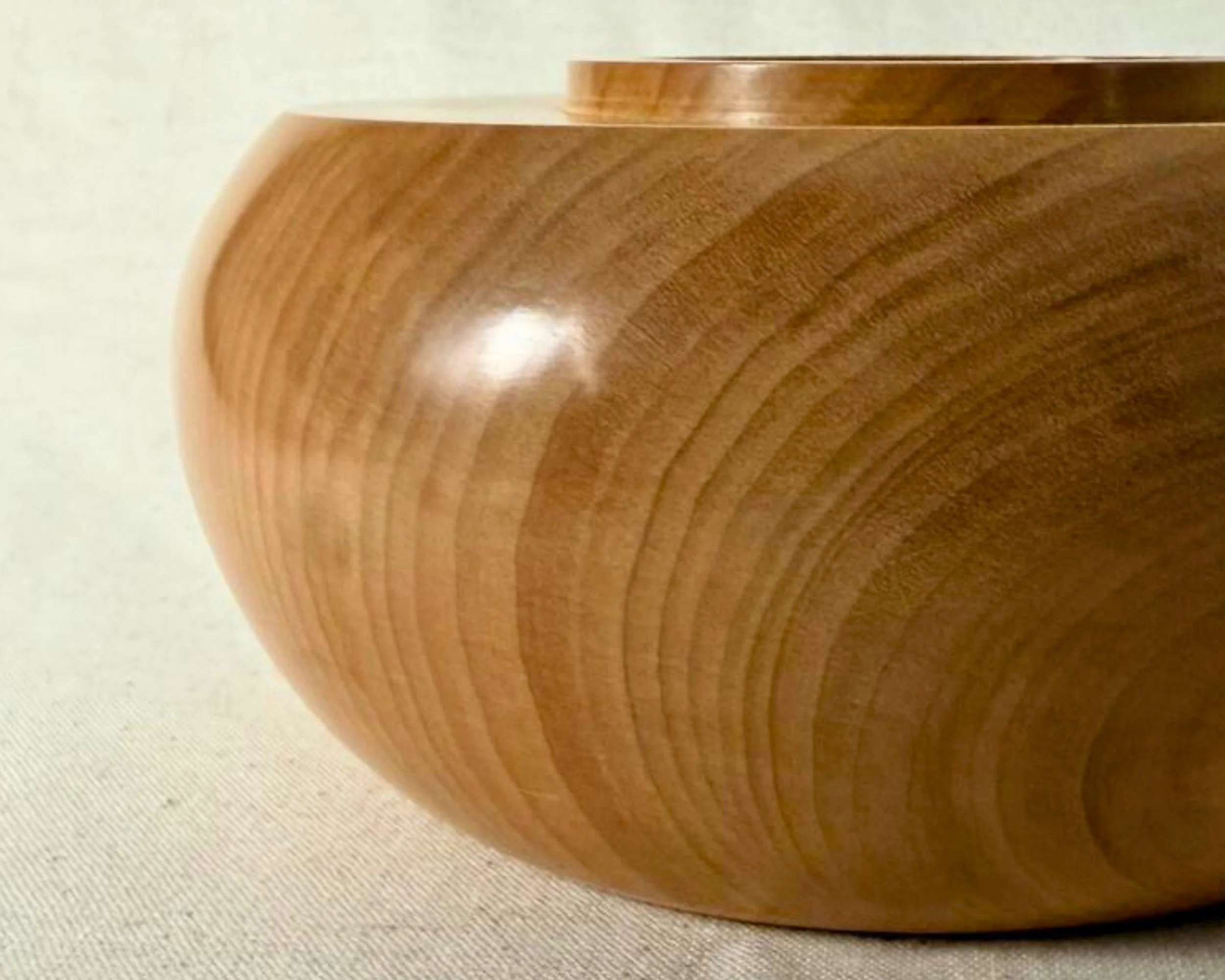 Close-up hero view of the raised collar opening on a maple closed form vessel, showing clean edges and smooth finish