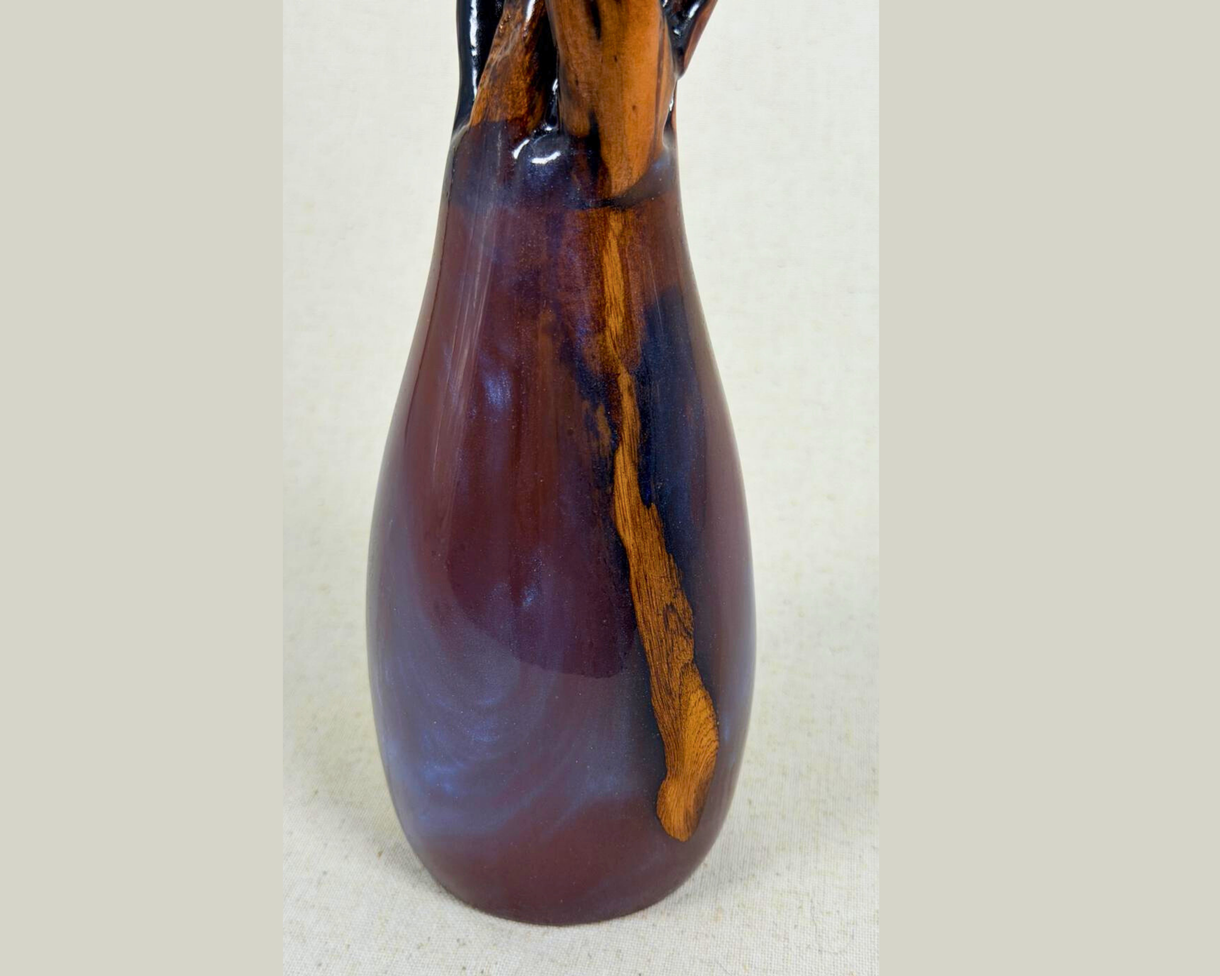 Mid-range view highlighting exposed driftwood running through the epoxy body of the sculpture.