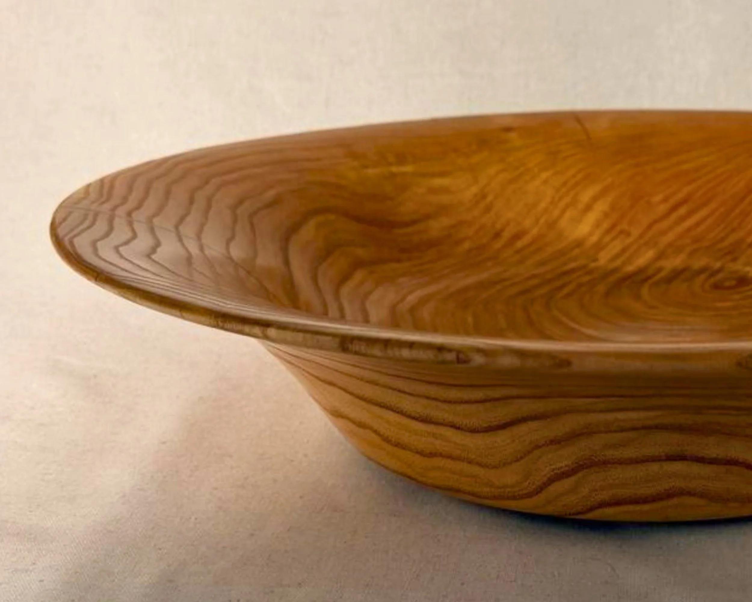 Side detail showing honey locust grain with a visible epoxy accent line near the rim