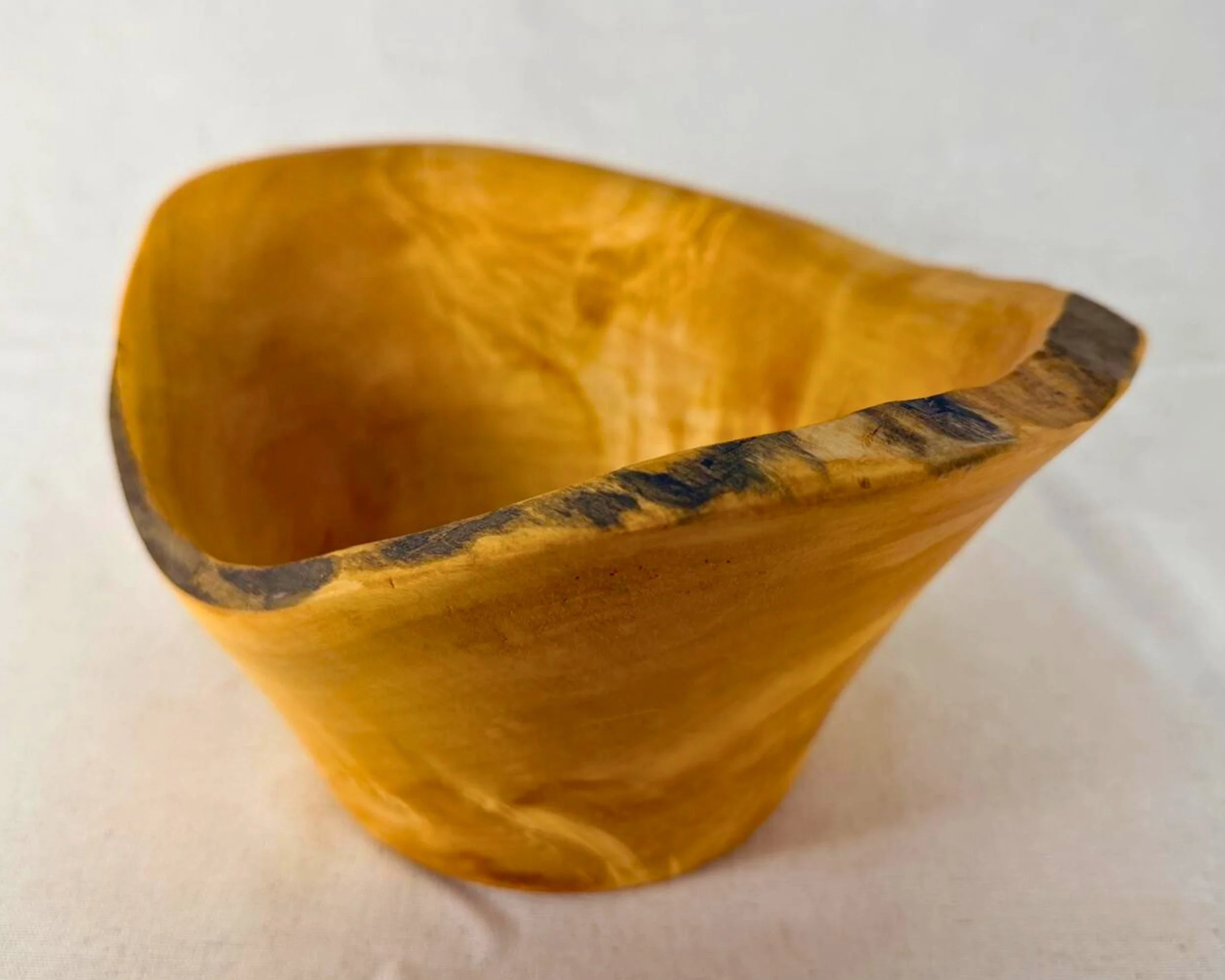 Side rotation view of reclaimed pine vessel emphasizing flared walls and lifted rim.