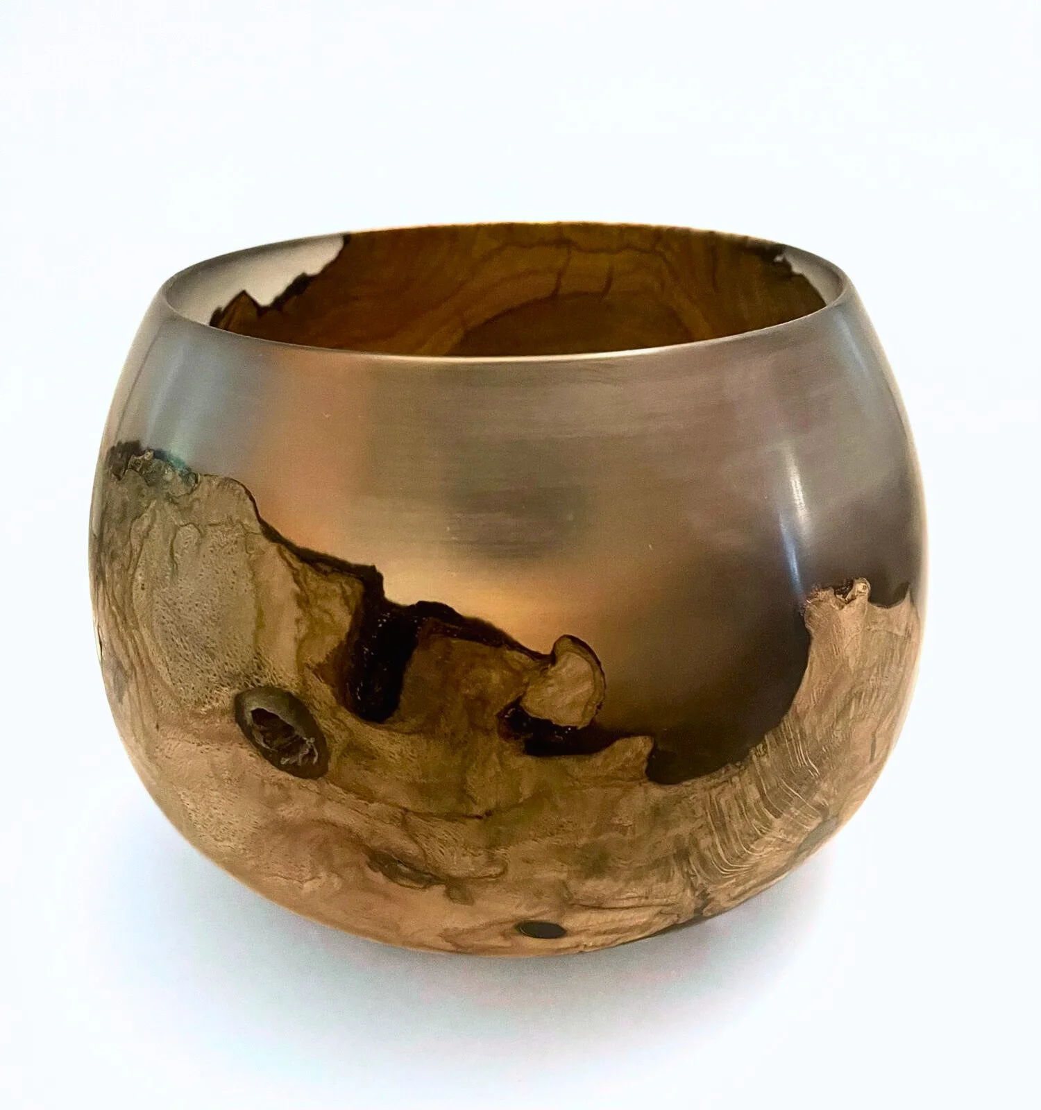 A handturned wood and epoxy decorative bowl with a smooth, polished finish, showing natural wood grain and knots, on a white background.