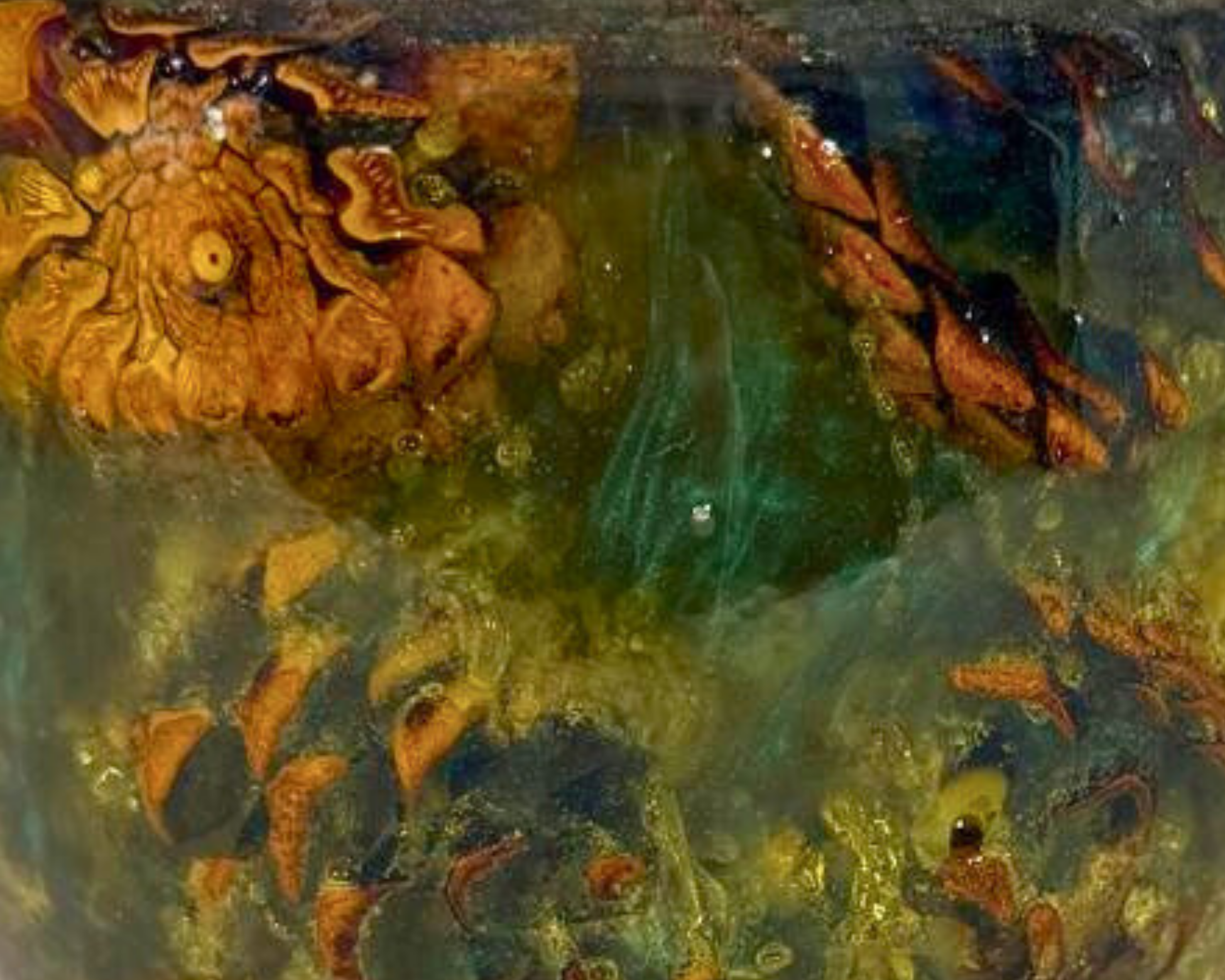 Macro view of the vessel surface showing a large pine cone inclusion surrounded by translucent teal-green epoxy with warm amber highlights.