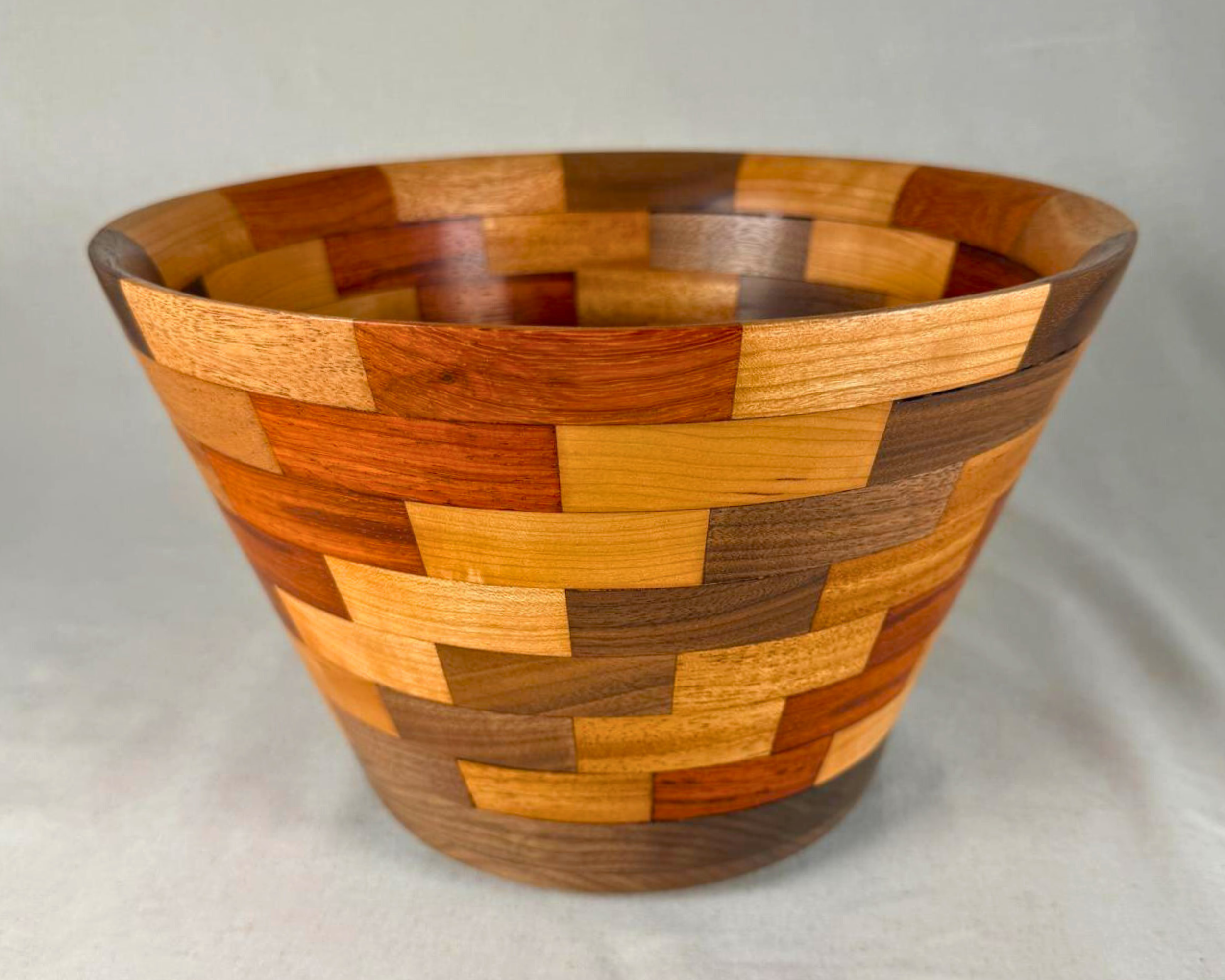 Front-facing view of the segmented vessel with strong emphasis on the repeating block pattern and wide 11-inch diameter opening.