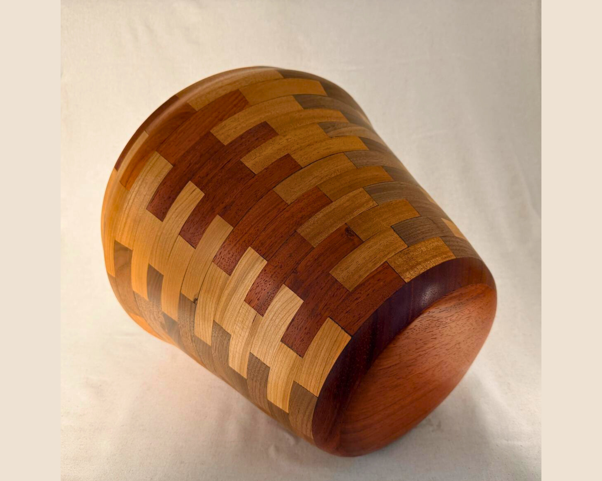 Segmented vessel shown on its side revealing base shape and continuous segmented pattern.