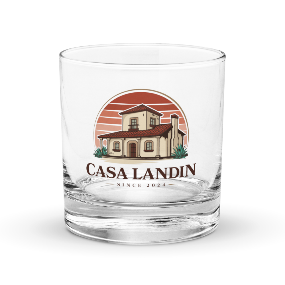 A clear glass with a logo of a house and sunset, and the text 'Casa Landin Since 2024' on it.