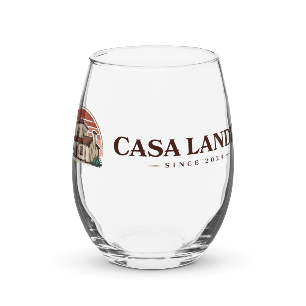 A clear glass with a logo that reads 'Casa Land Since 2024' and an image of a house on it.