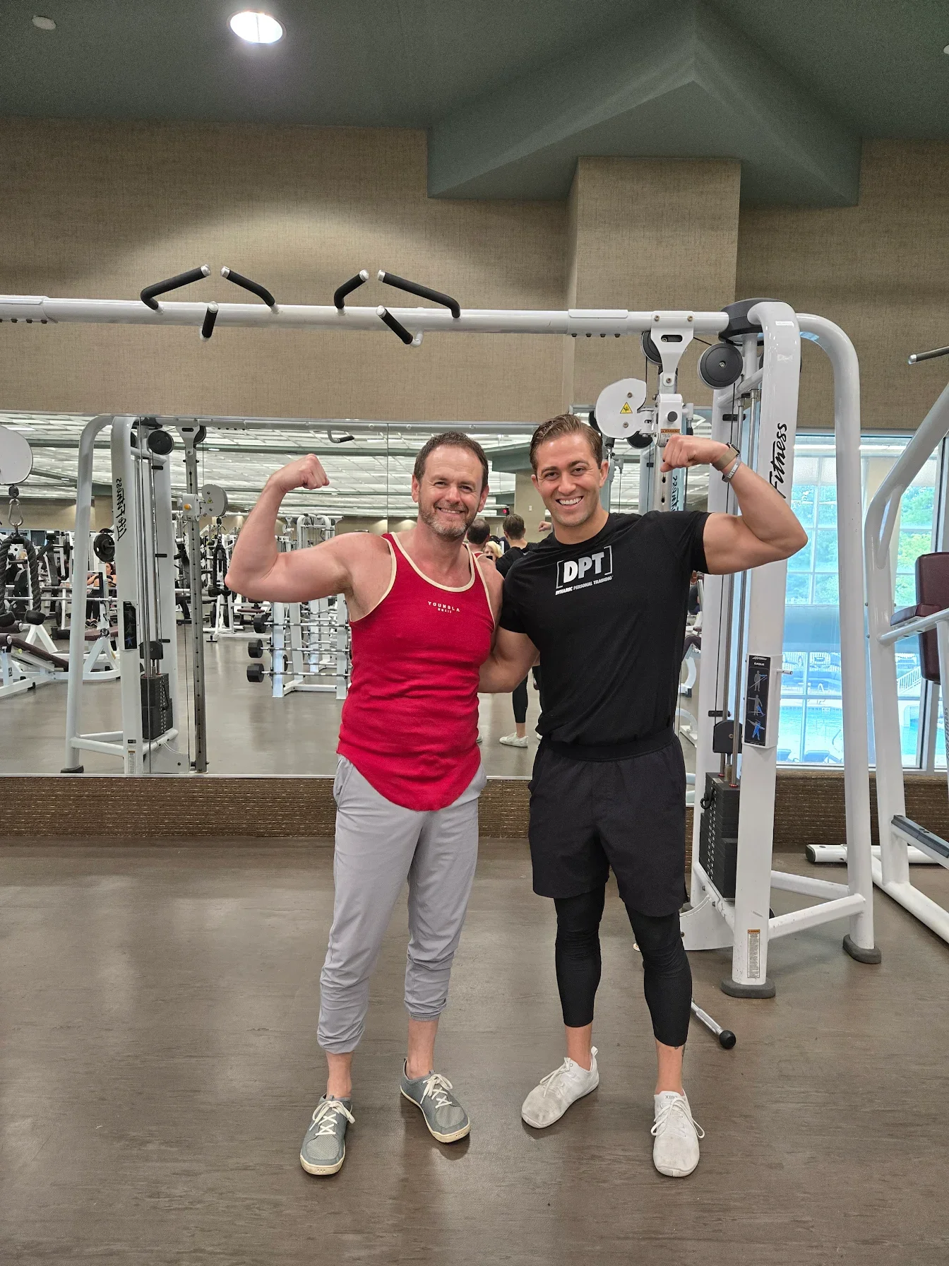 Thaddeus Winston personal trainer Life Time Easton with Client for review