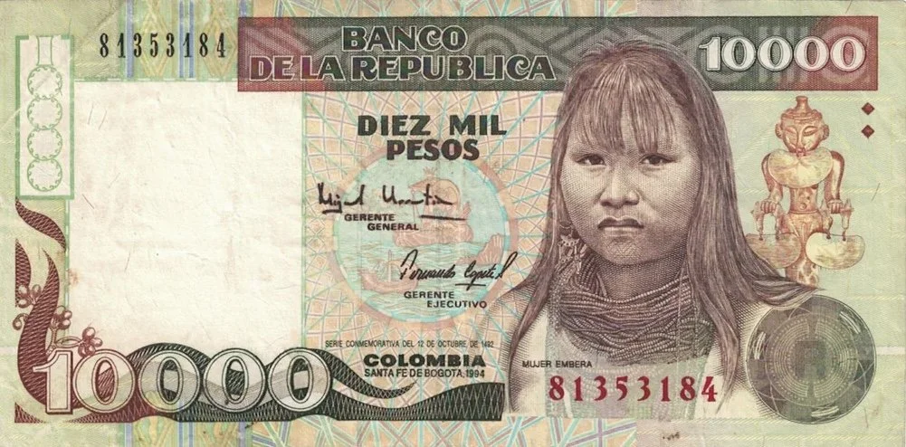 Colombian 10,000 pesos banknote featuring a child's portrait and traditional elements.
