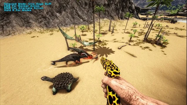 In a video game scene set on a sandy beach, a player's hand is holding a yellow and black patterned rifle aimed at a group of dinosaurs, including a small turtle and a larger theropod dinosaur near the shoreline, with trees and cliffs in the background.