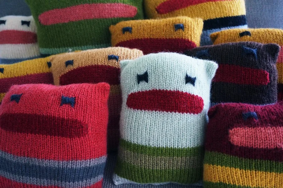 Photograph of stuffed pillow creatures.