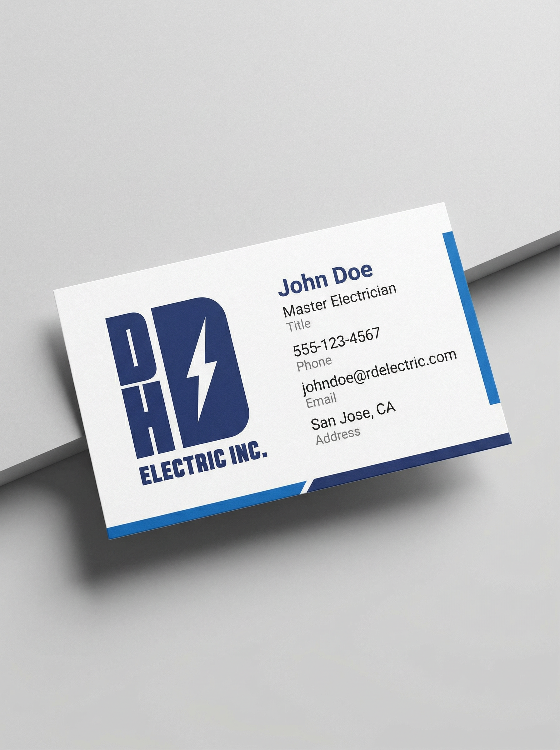 Business card for John Doe, Master Electrician at DHD Electric Inc., displaying contact information including phone number, email, and location in San Jose, CA, with the company logo featuring a lightning bolt.