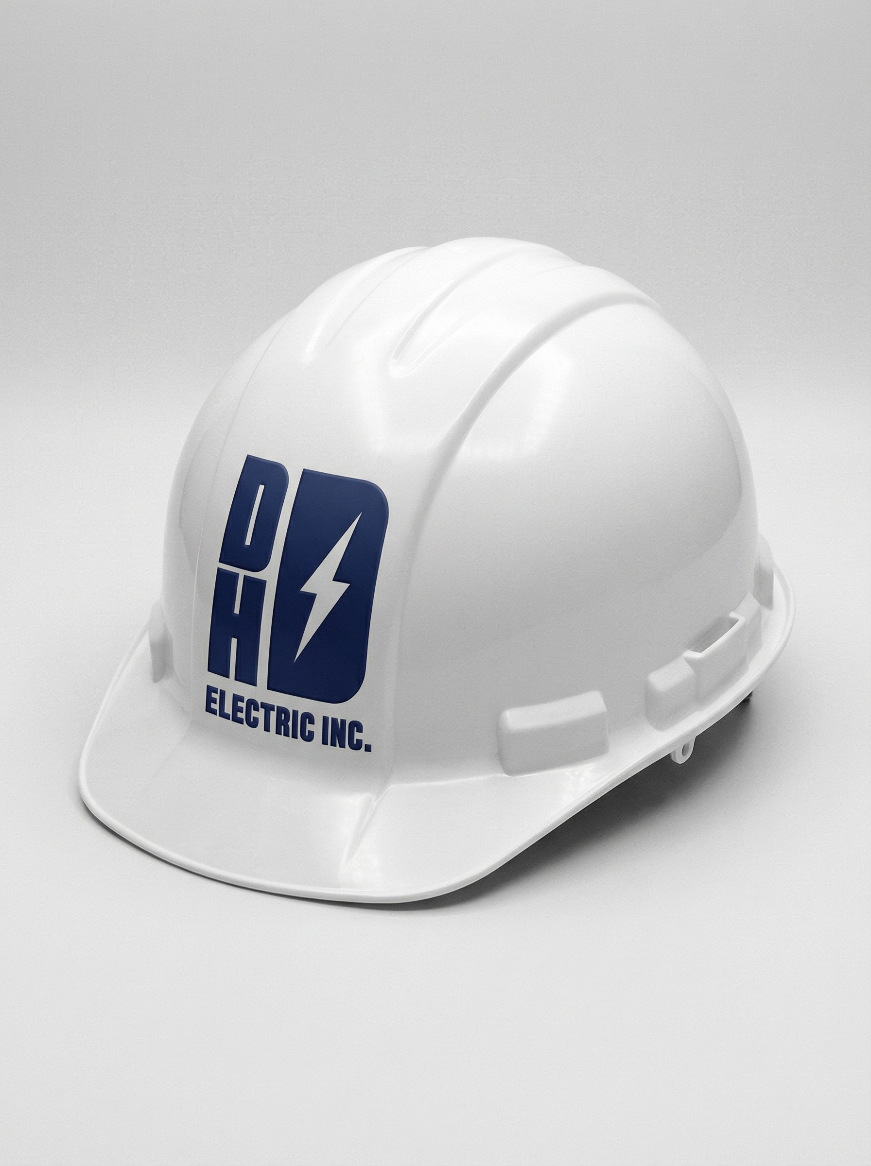 White safety helmet with a logo for DHD Electric Inc. and a lightning bolt symbol on the front.