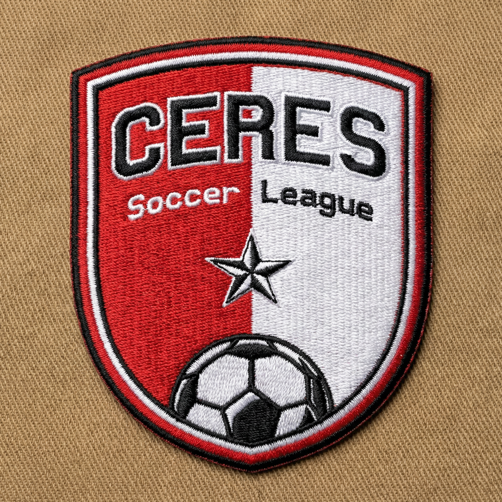 Ceres Soccer League patch featuring red and white shield divided vertically, with a star and a soccer ball at the bottom.