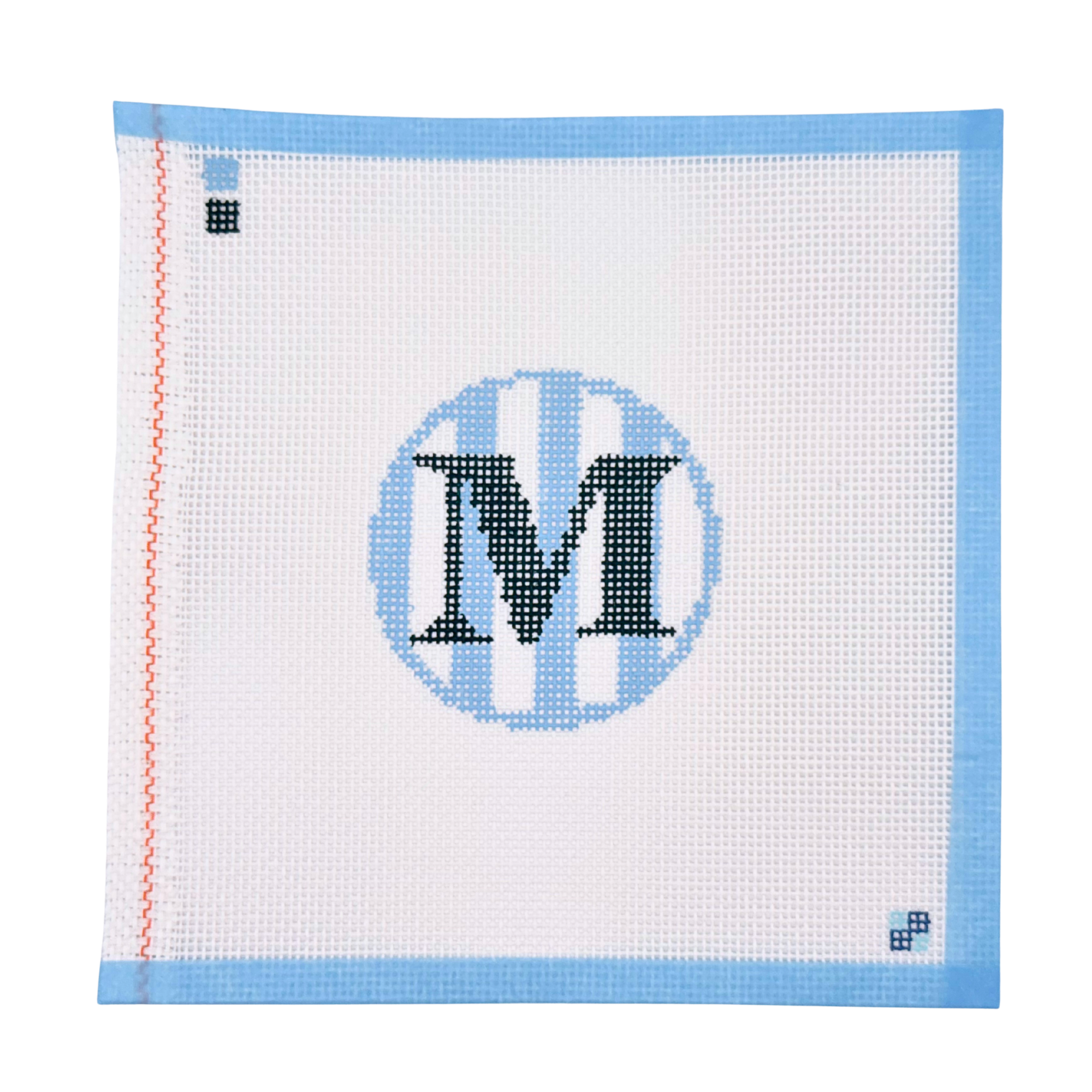 Hand-painted blue stripe letter M needlepoint canvas from McCain Collective.