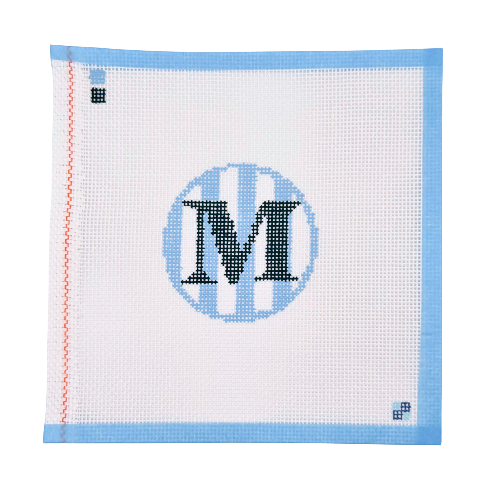 Hand-painted blue stripe letter M needlepoint canvas from McCain Collective.