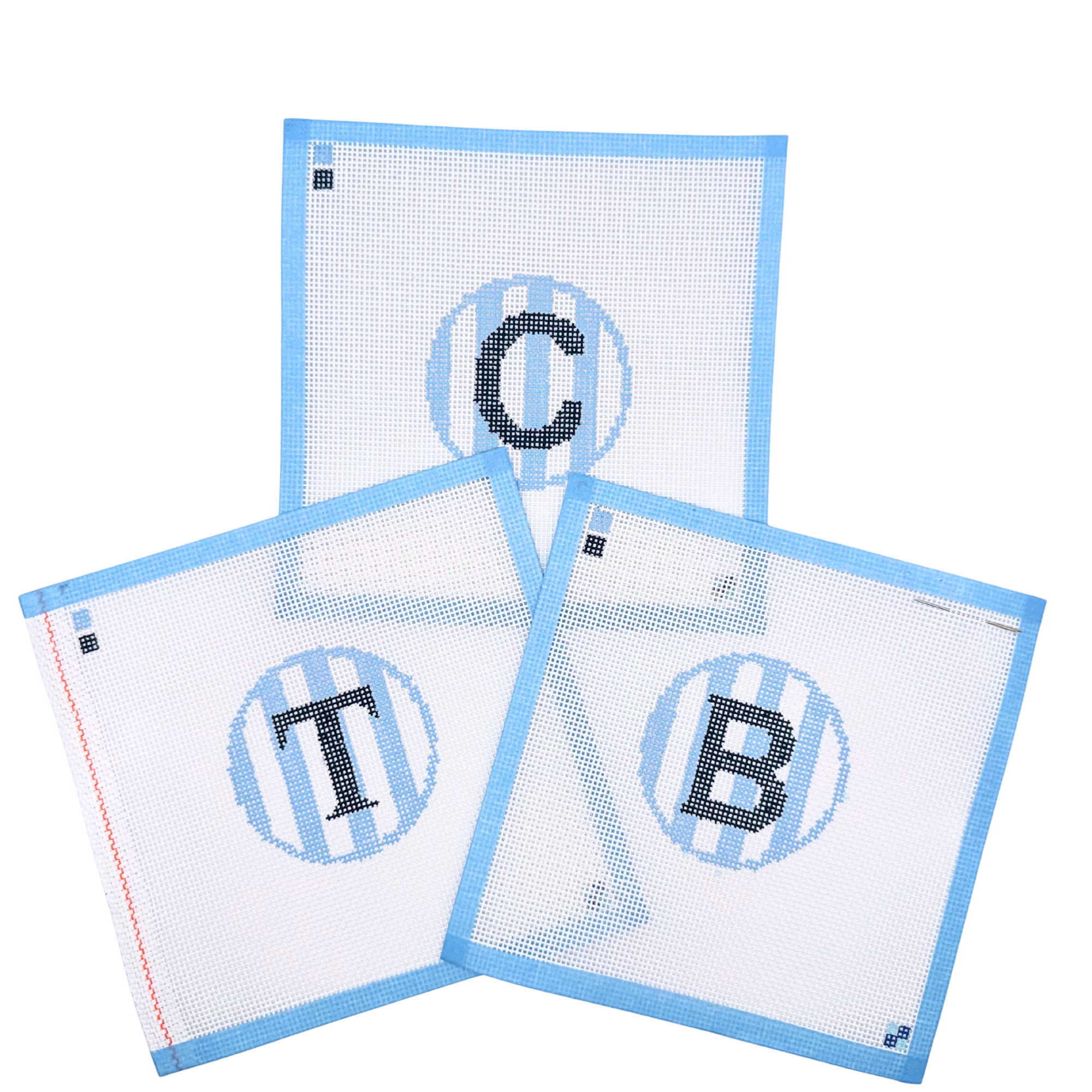 Hand-painted blue stripe letter C, B, & T needlepoint canvases from McCain Collective.