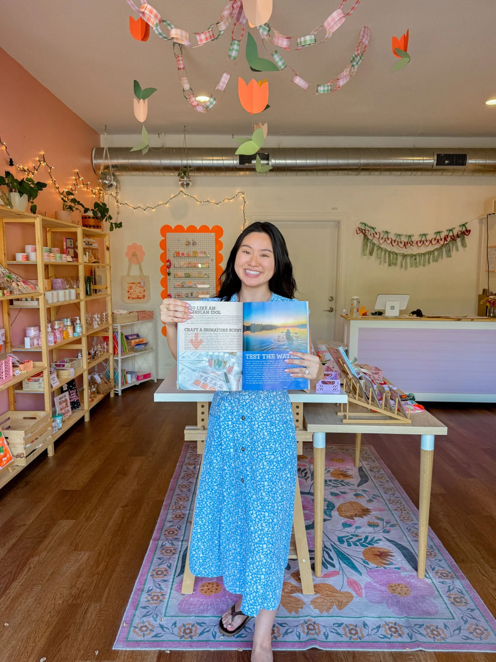 Sunkissed & Co. founder holding Sactown Magazine feature