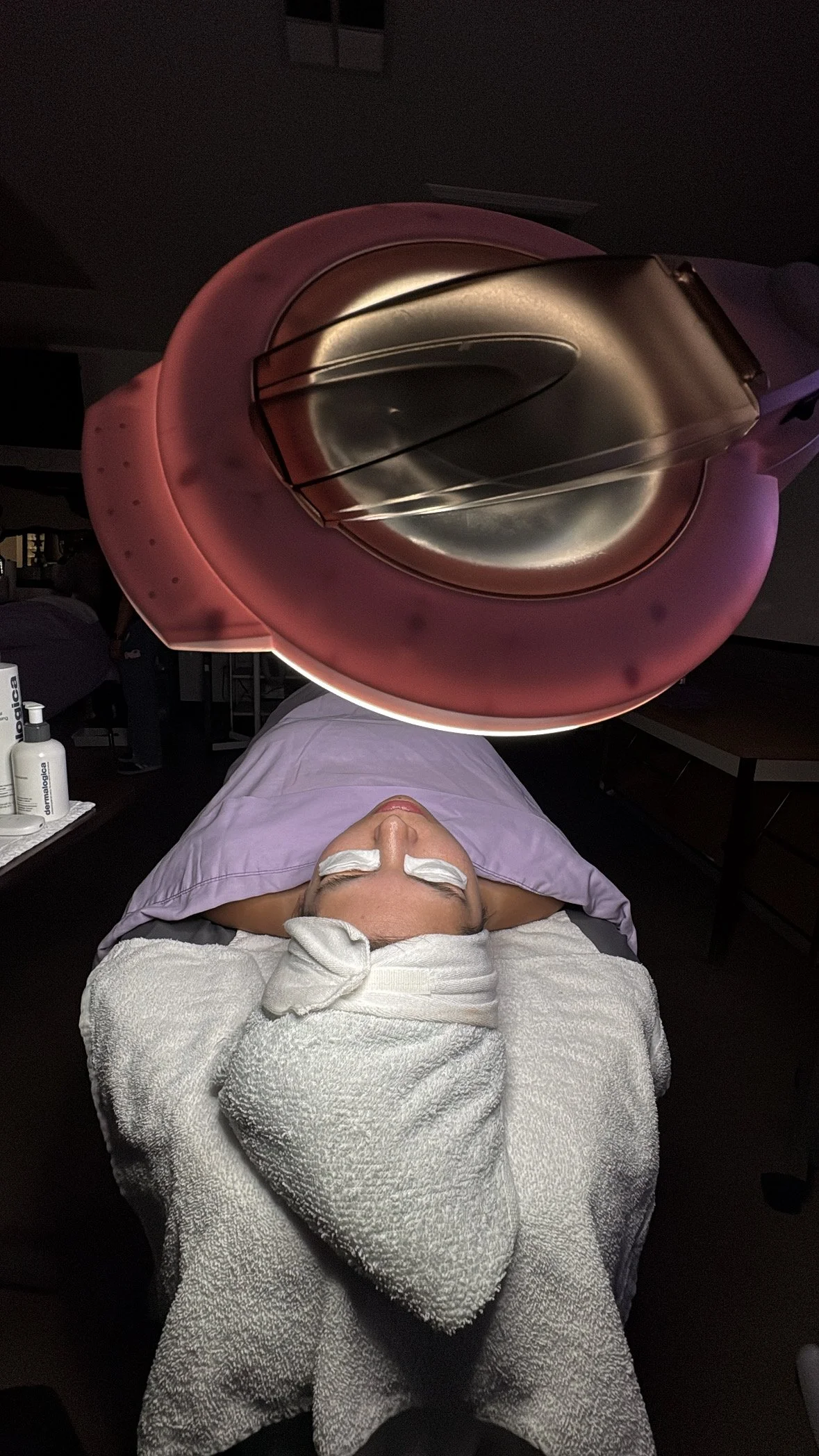 Pre-Extraction Phase, Beautiful woman laying on extraction table with magnifying light