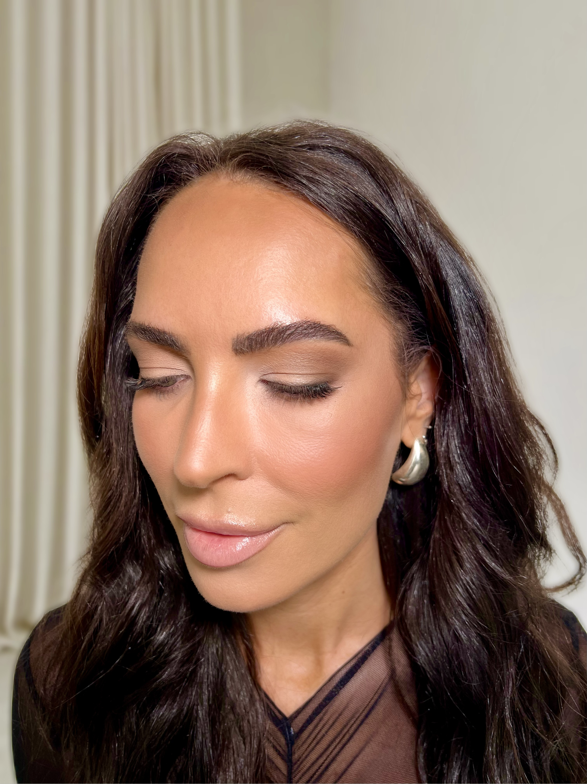 Close-up of a bridal client with soft glam makeup and closed eyes, wearing silver earrings - Makeup by Anastasia, Melbourne.