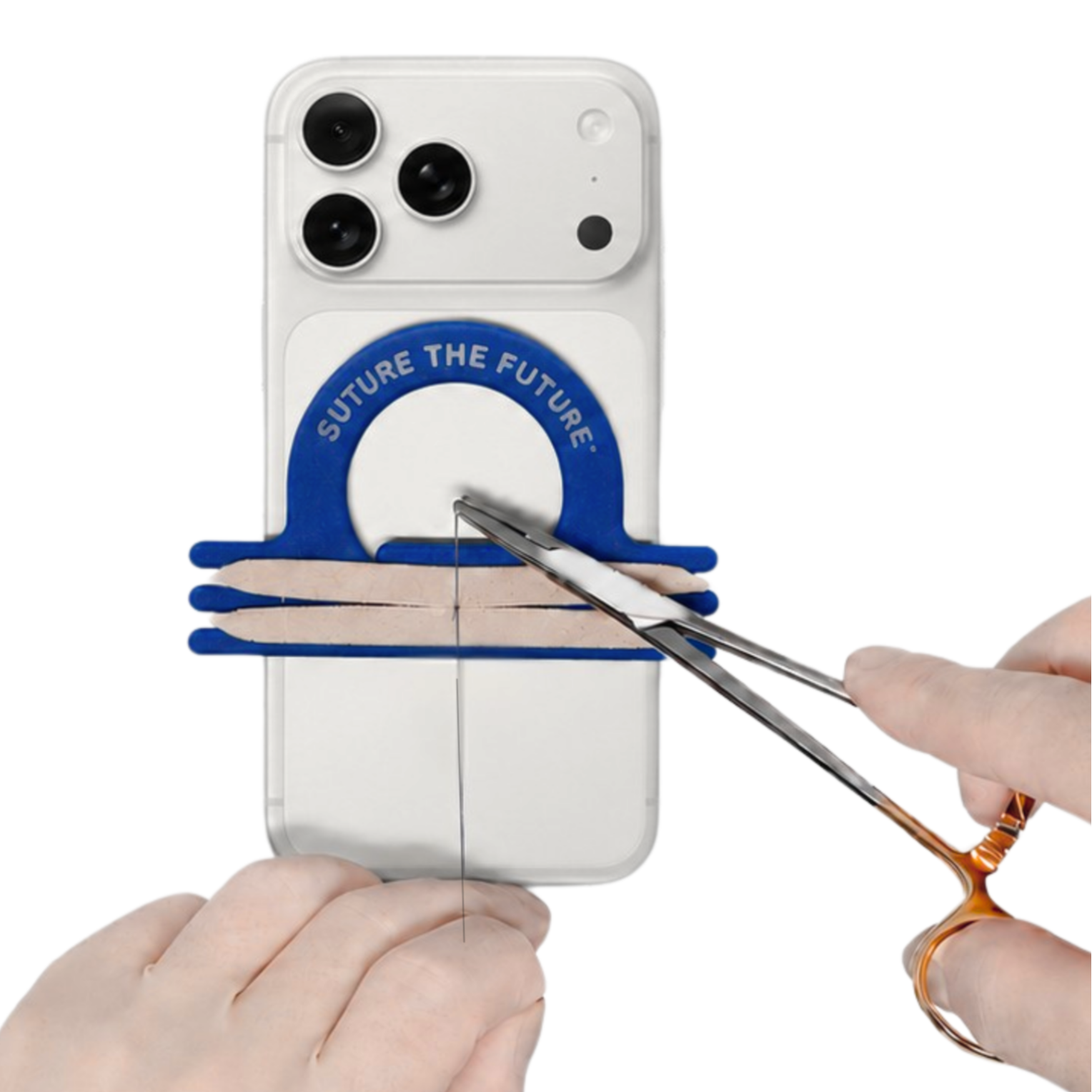 The suturing and hand knot tying practice tool is magnetically attached to a magsafe smartphone. Medical student hands practice suturing on an elastic band that simulates a wound, showcasing how portable and convenient it is than a silicone pad.