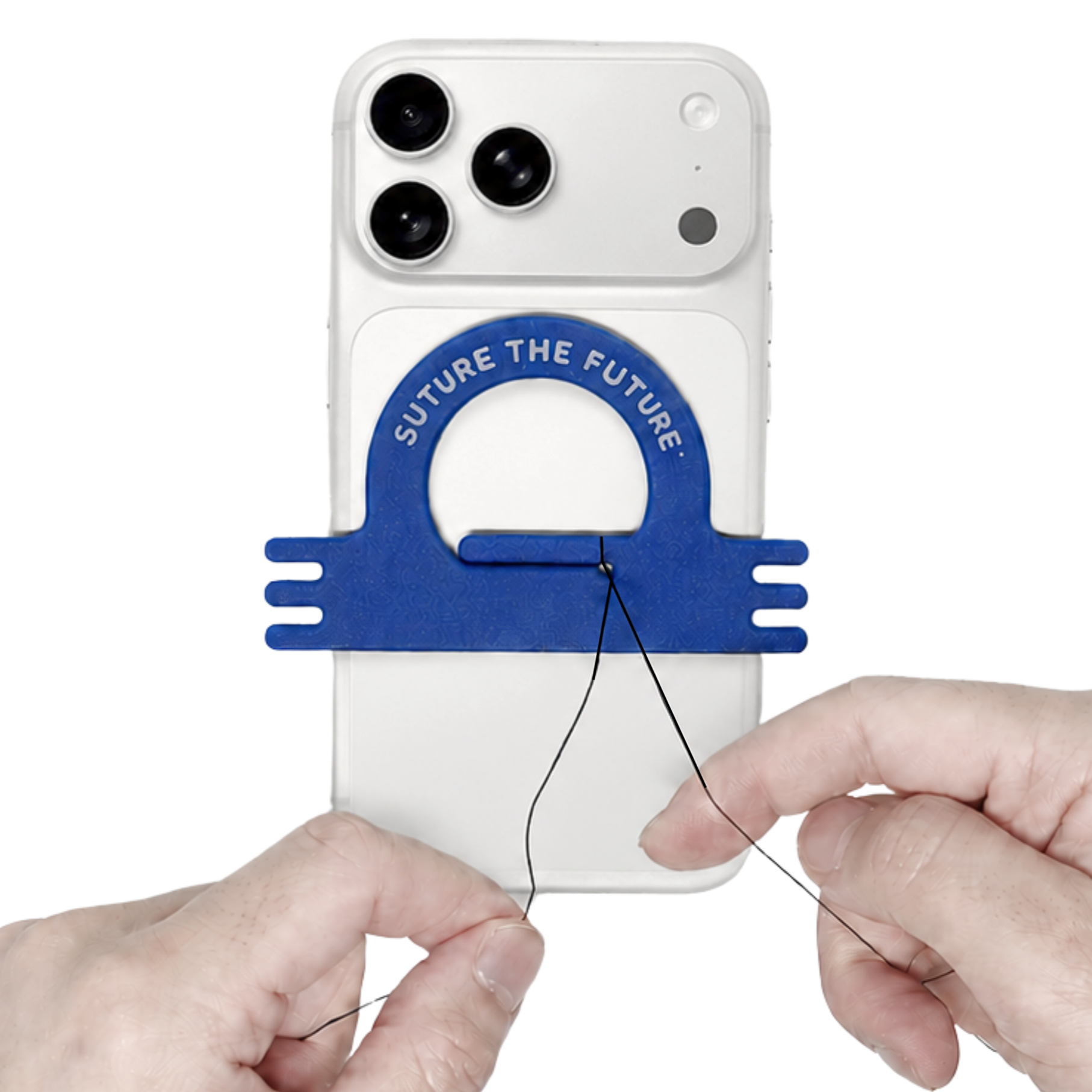 The suturing and hand knot tying practice tool is magnetically attached to a magsafe smartphone. Medical student hands practice medical knot tying with the suture tied to the tool, showcasing how portable and convenient it is.