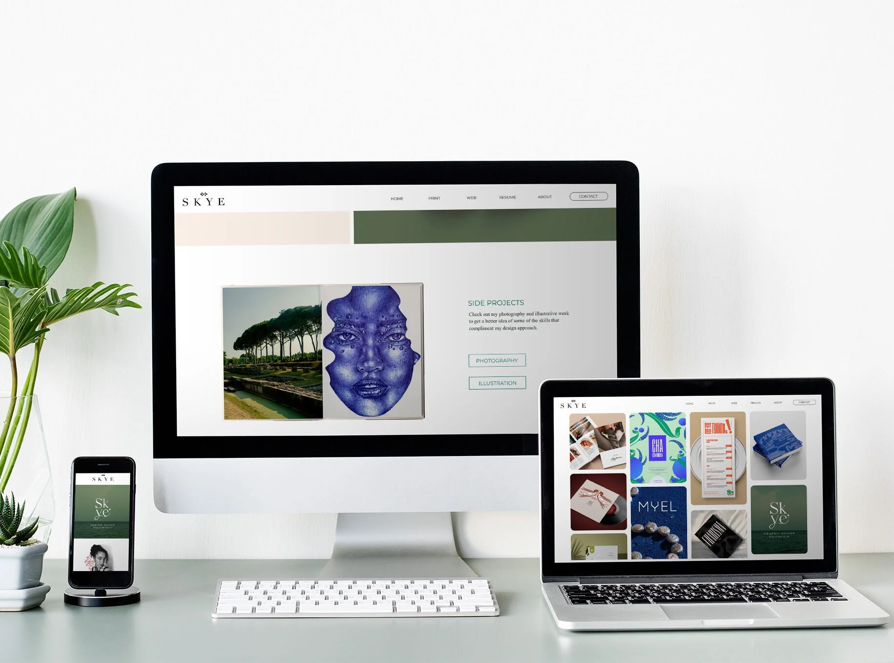 Desk with Apple iMac, MacBook, iPhone, and potted plants, displaying various website and design portfolio images.