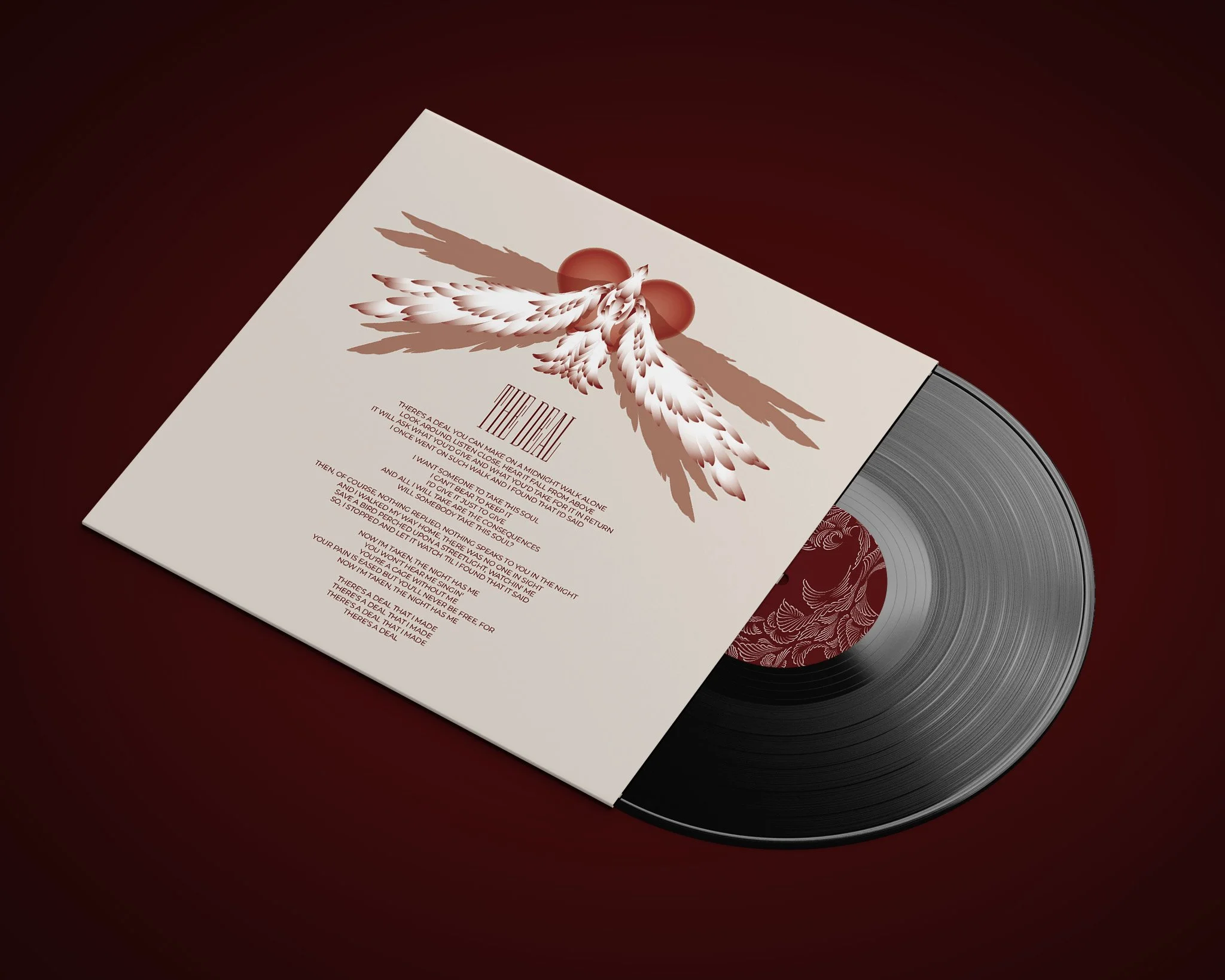 Vinyl record partially visible with a white album sleeve featuring a winged design and red accents.