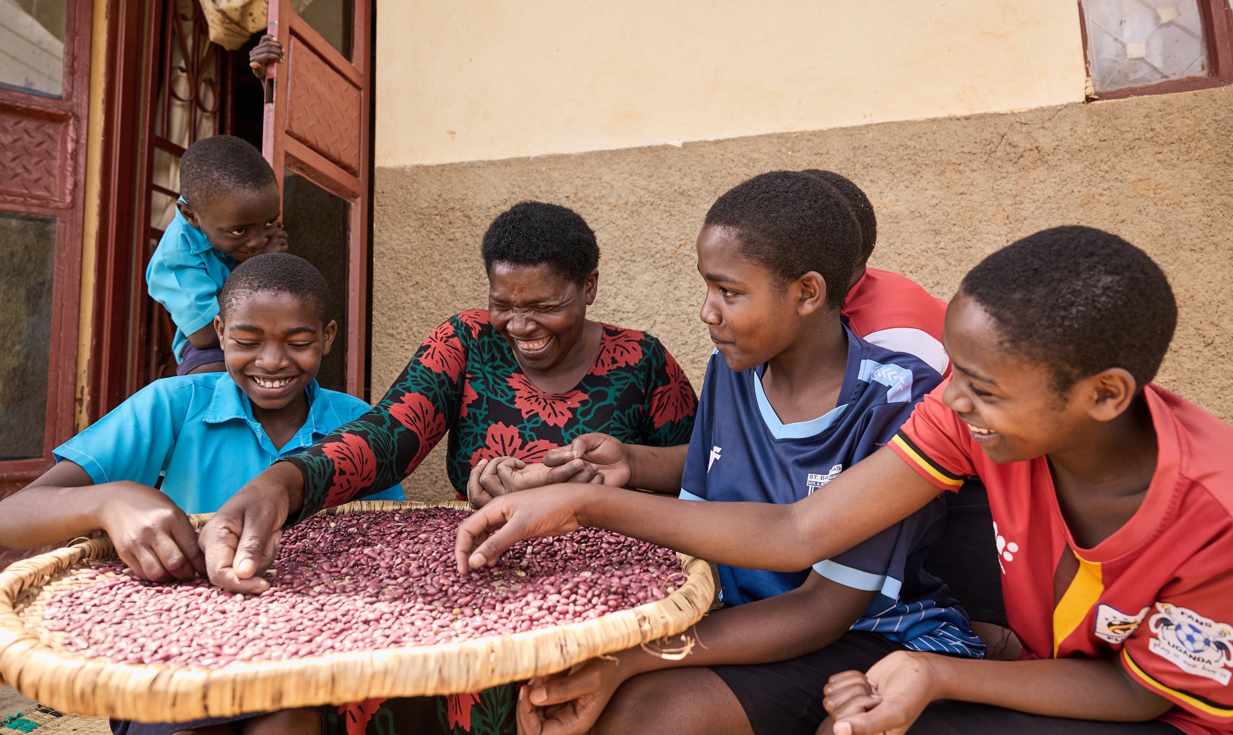 Documentary photograph for NUNU Fund showing smallholder farming, community trade, and financial inclusion in Uganda