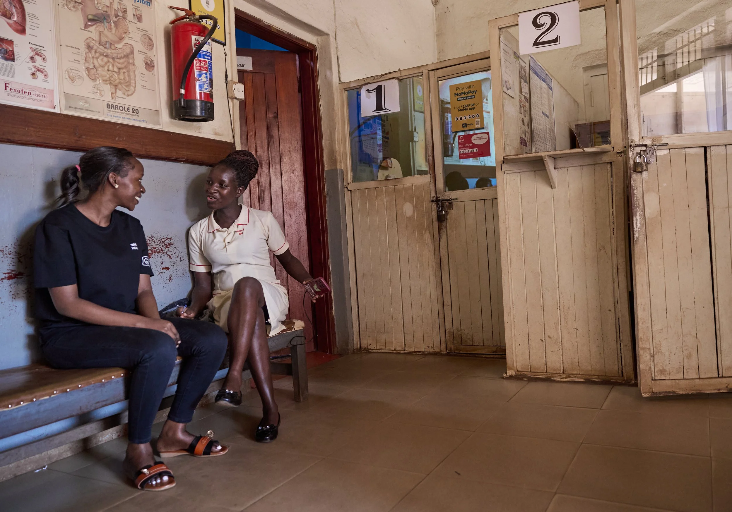 Documentary image showing how local language voice call reminders support continuity of care and community health in Uganda, Africa