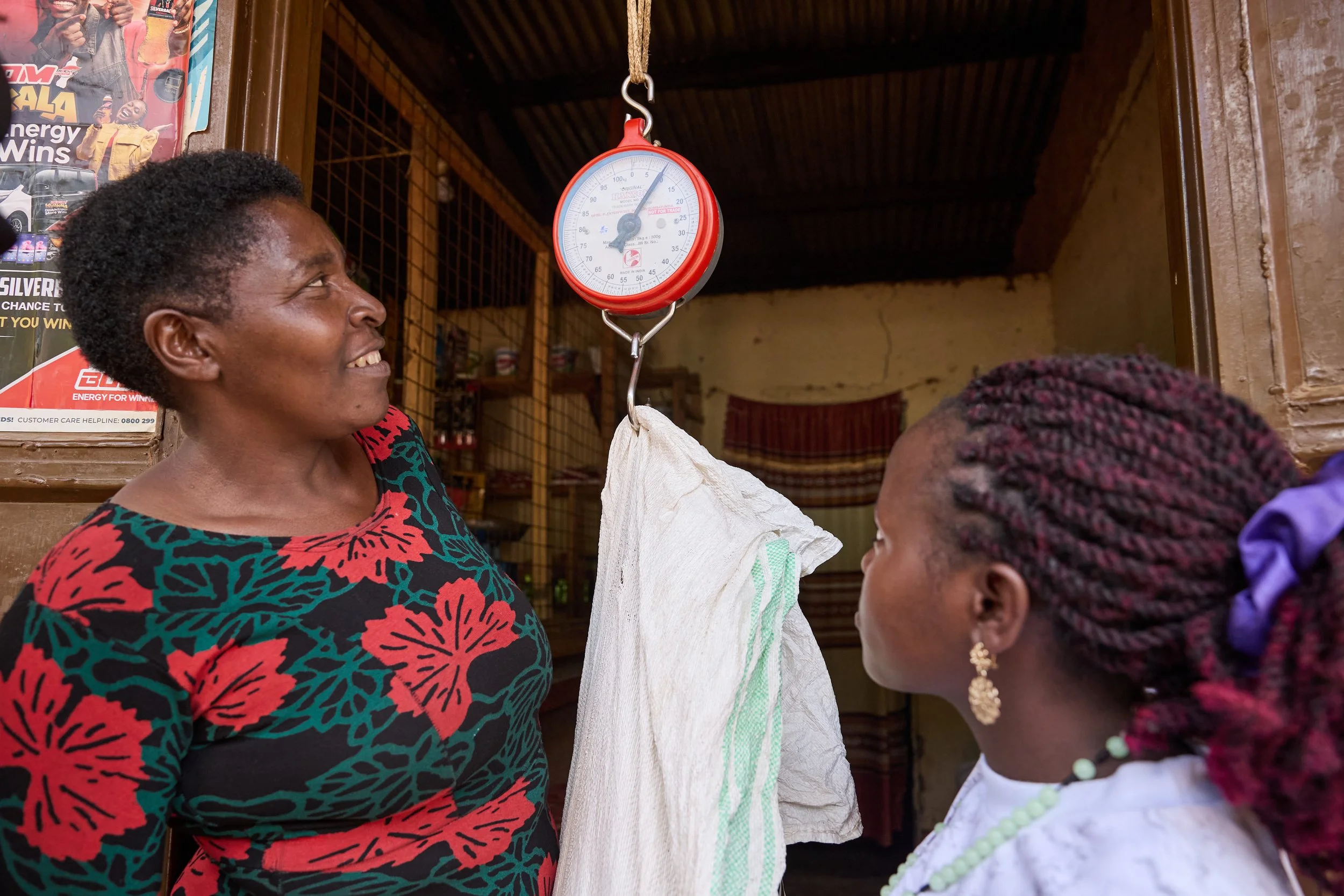 Documentary photograph for NUNU Fund showing smallholder farming, community trade, and financial inclusion in Uganda