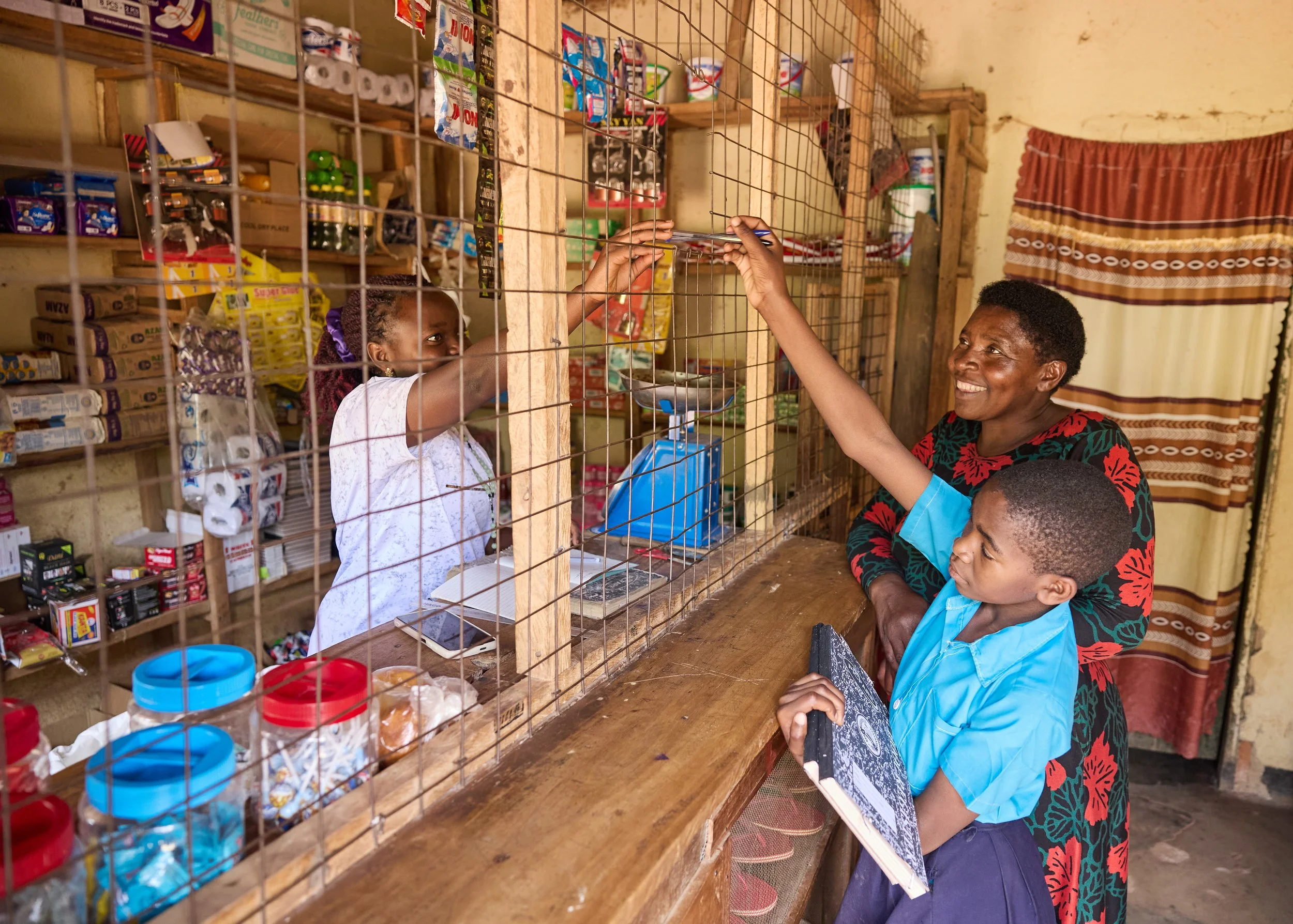 Documentary photograph for NUNU Fund showing smallholder farming, community trade, and financial inclusion in Uganda
