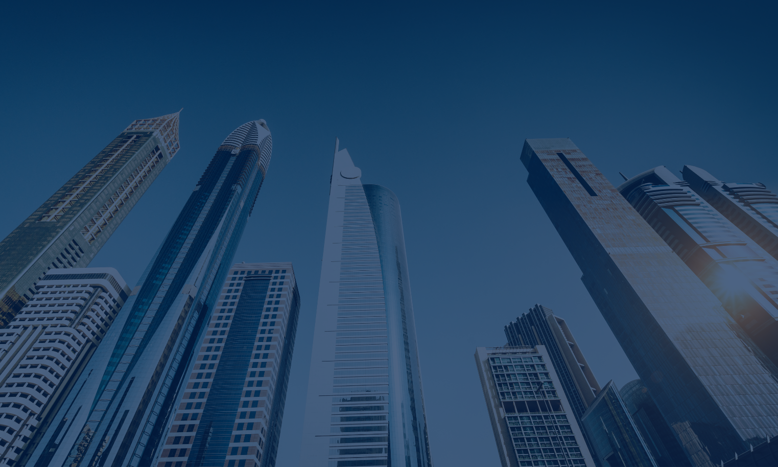 Skyline of modern high-rise skyscrapers in a city with clear blue sky.