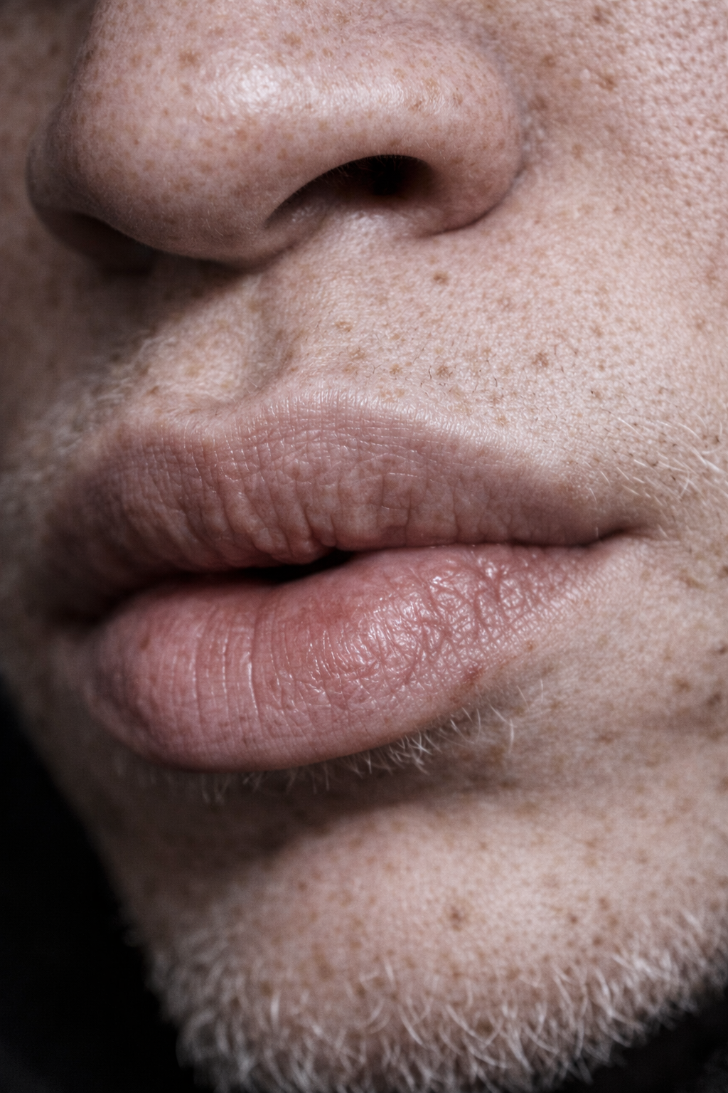 Close-up of a person's black nose, lips, and part of a mustache and beard.  Custom AI Influencer, AI persona.