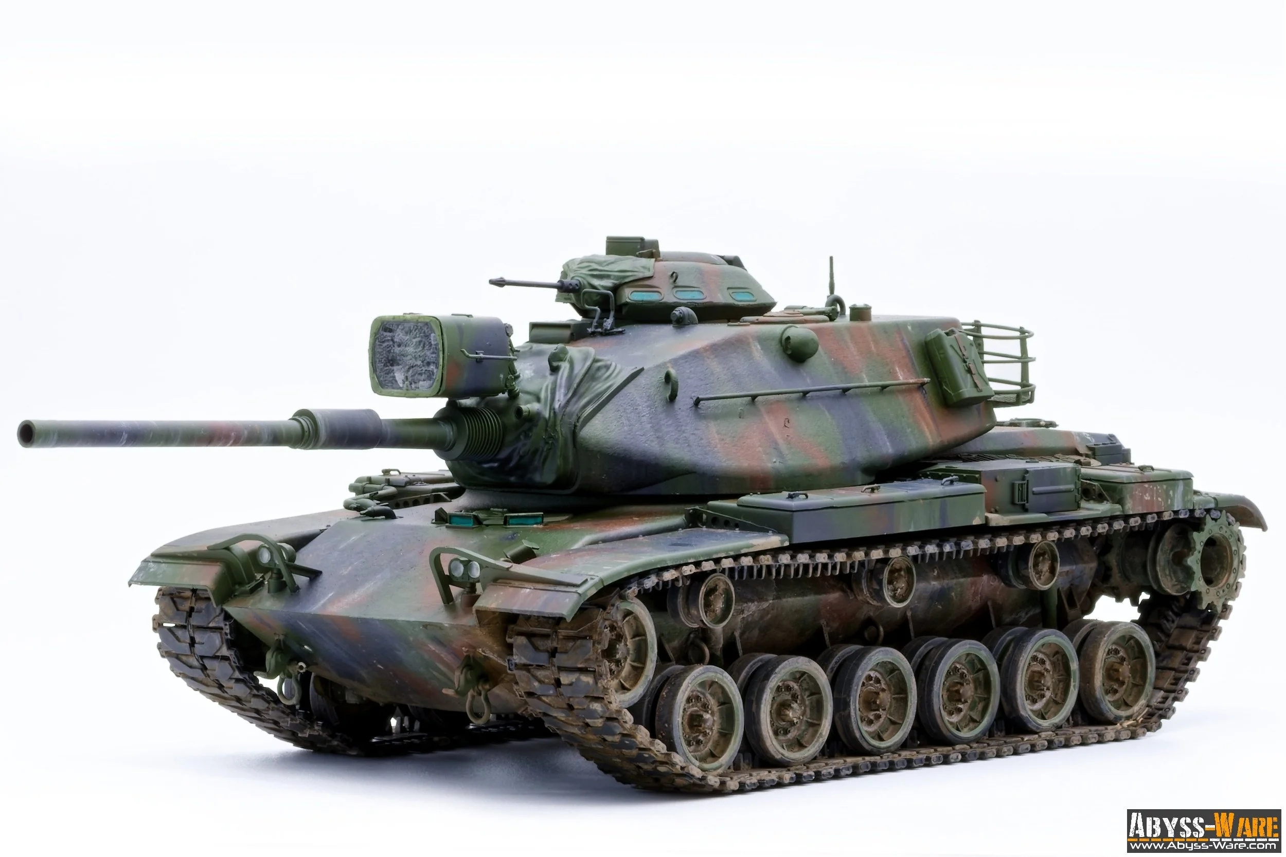 Model of a military tank with camouflage paint, featuring a long barrel, armored body, and tracked wheels, placed on a white background.