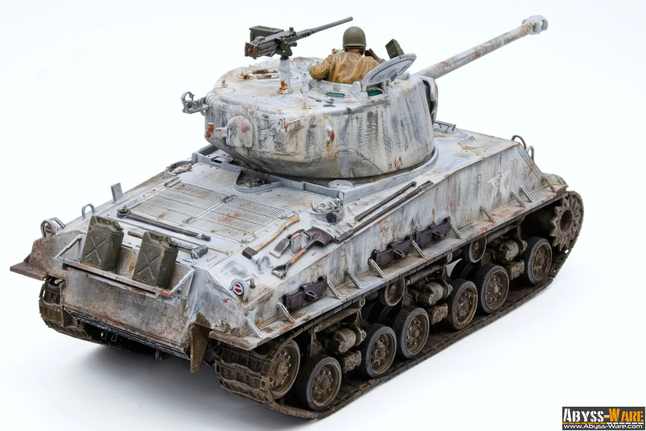 Model of a military tank with a small soldier figure in the turret, set against a plain white background.