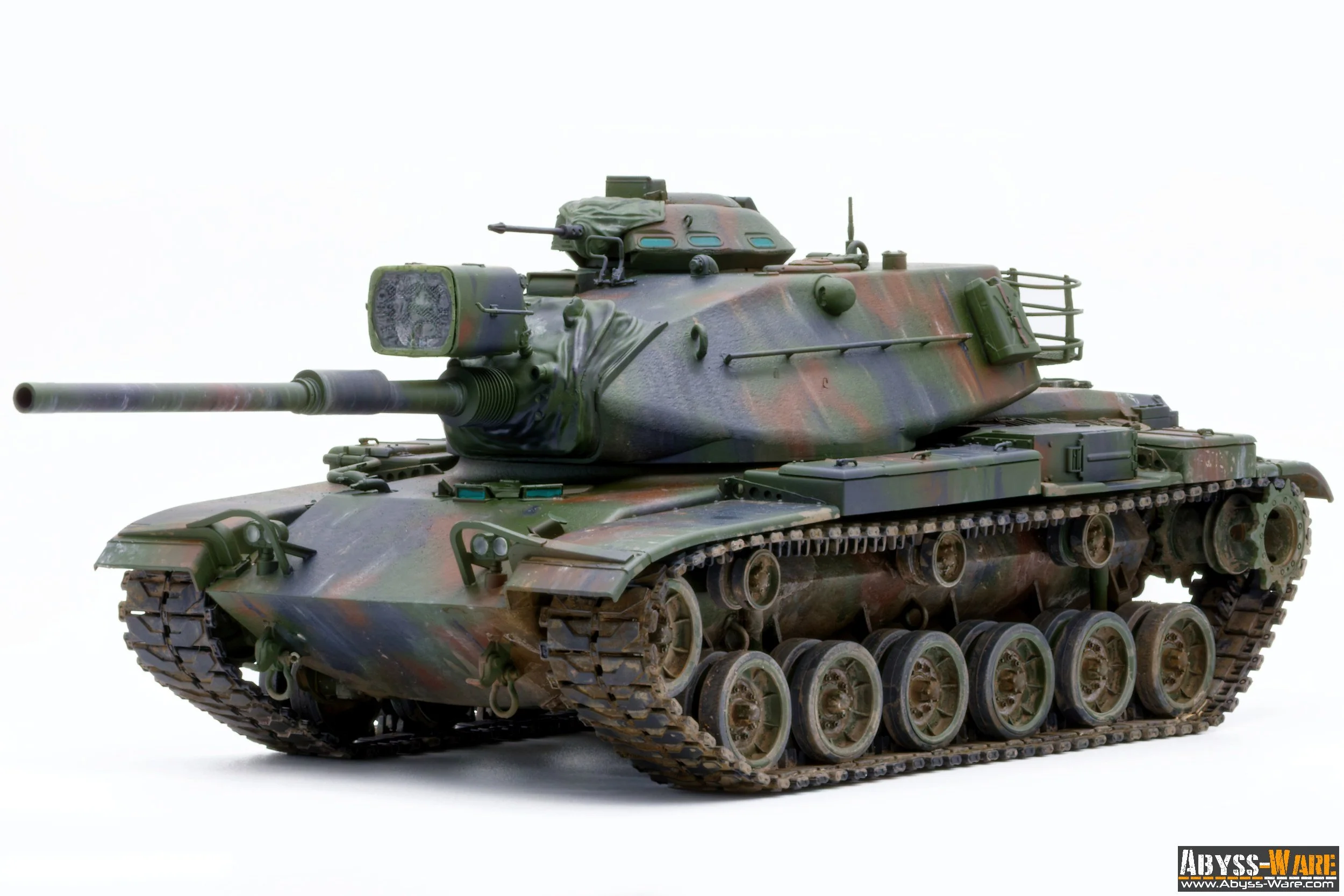 Model of a military tank with a camouflage pattern against a plain white background.