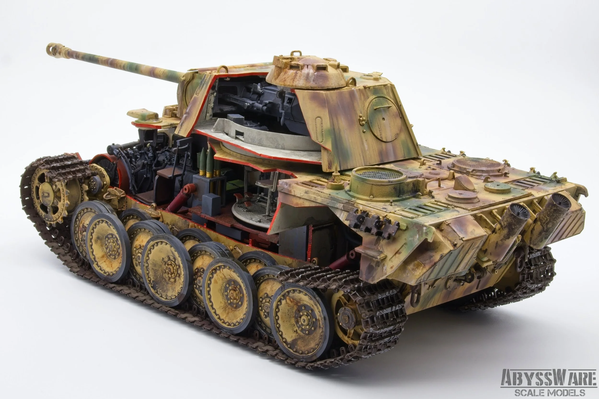 A detailed scale model of a military tank with an exposed interior, showcasing its internal components and mechanisms, painted in camouflage colors.